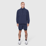 Navy Aerotex Quarter-Zip Jacket worn with matching shorts and white sneakers, front view
