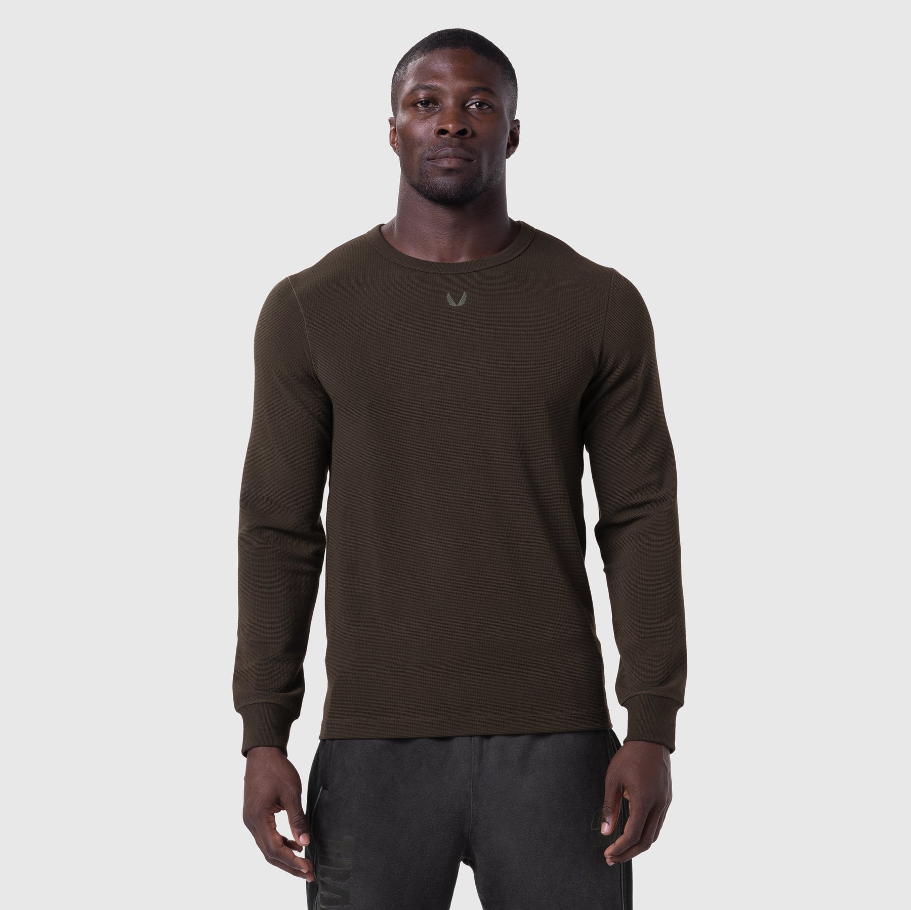 Waffle knit longsleeve in dark earth, worn by model, front view