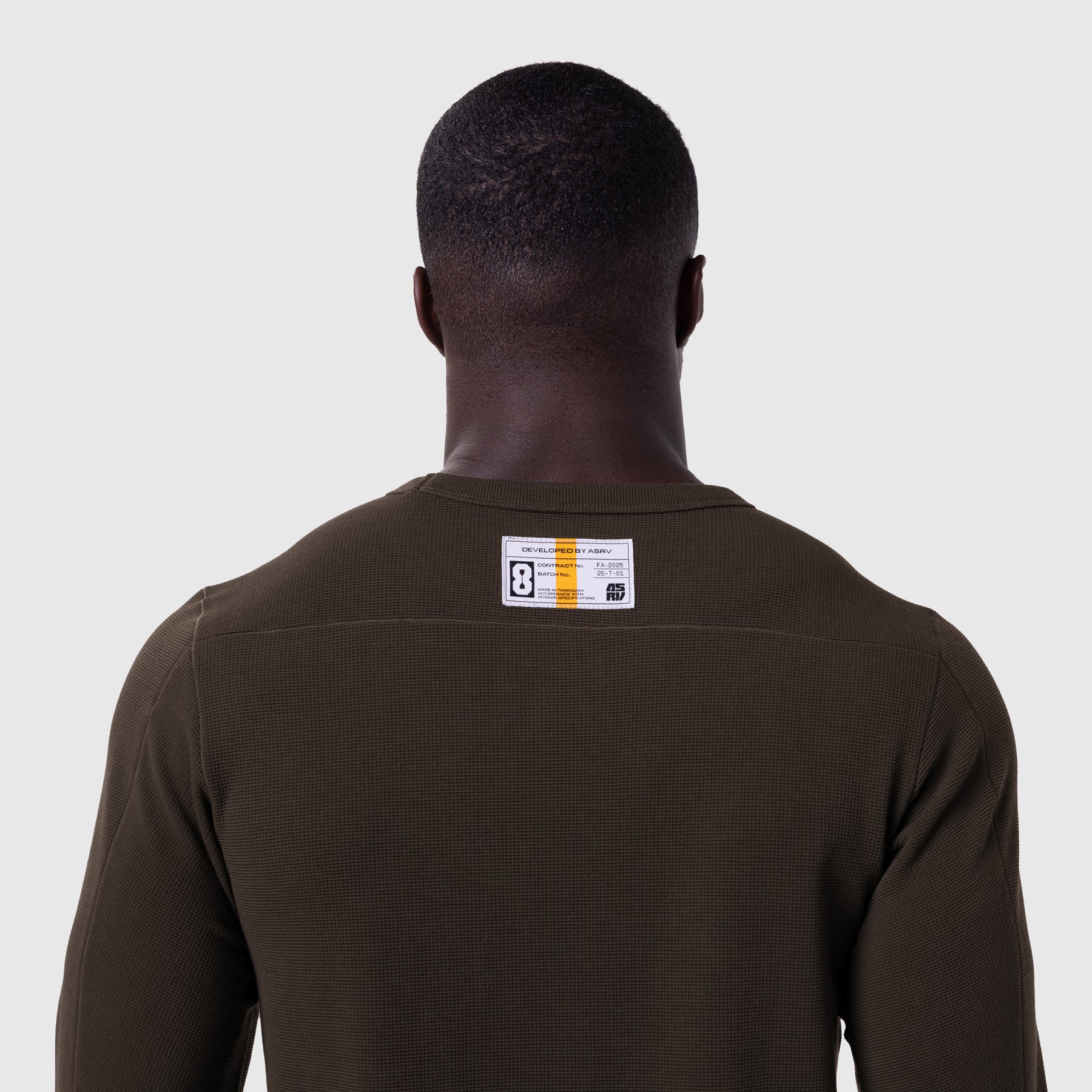 Waffle knit longsleeve in dark earth, back view on model
