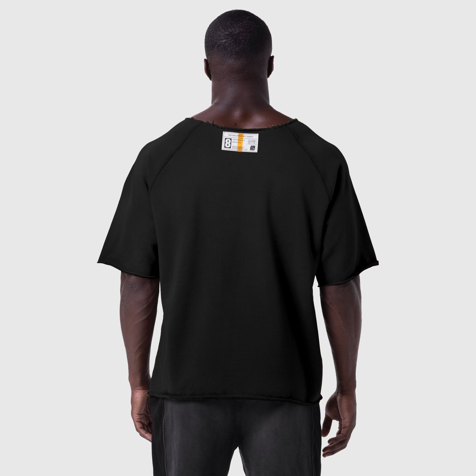Black vintage raw hem pump cover t-shirt on model, back view