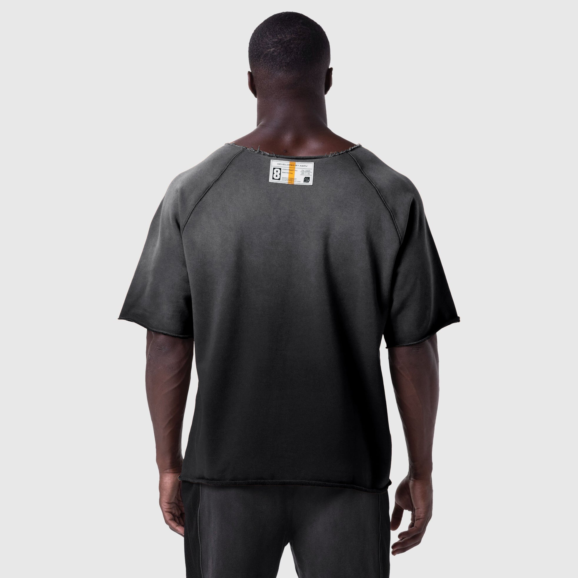Black vintage raw hem t-shirt worn by model, back view