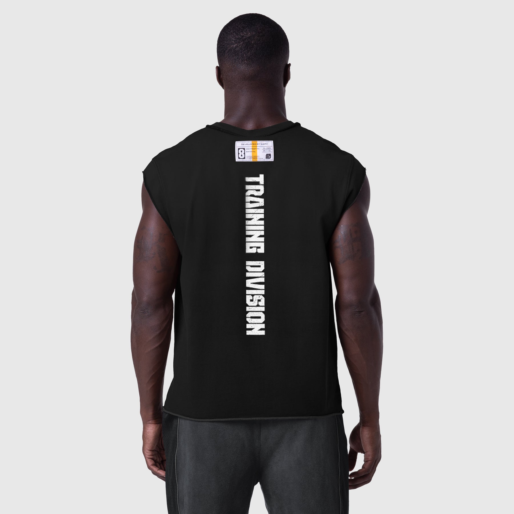 Tech Essential Cap Shoulder Cutoff tank top in black, back view on model