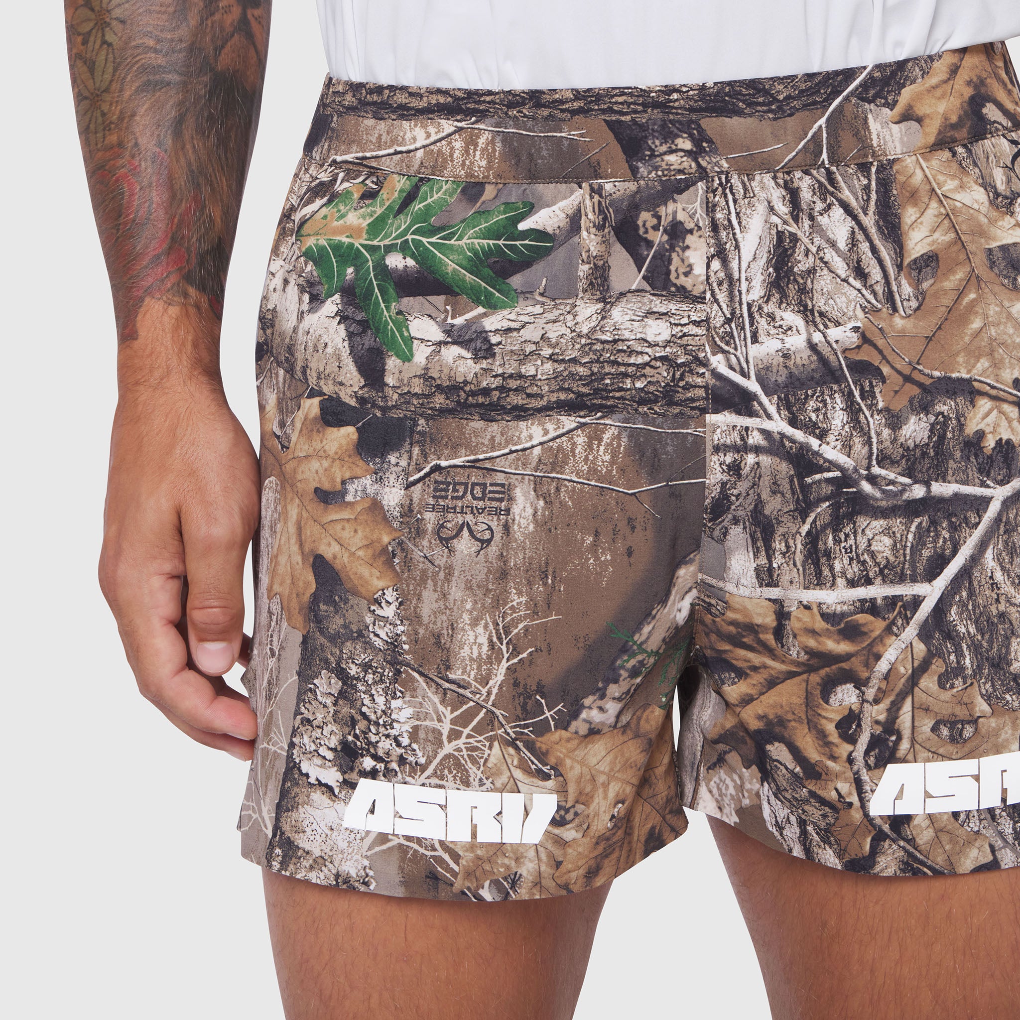 Aerotex Distance Short in Realtree Edge camo, modeled on person showing side view