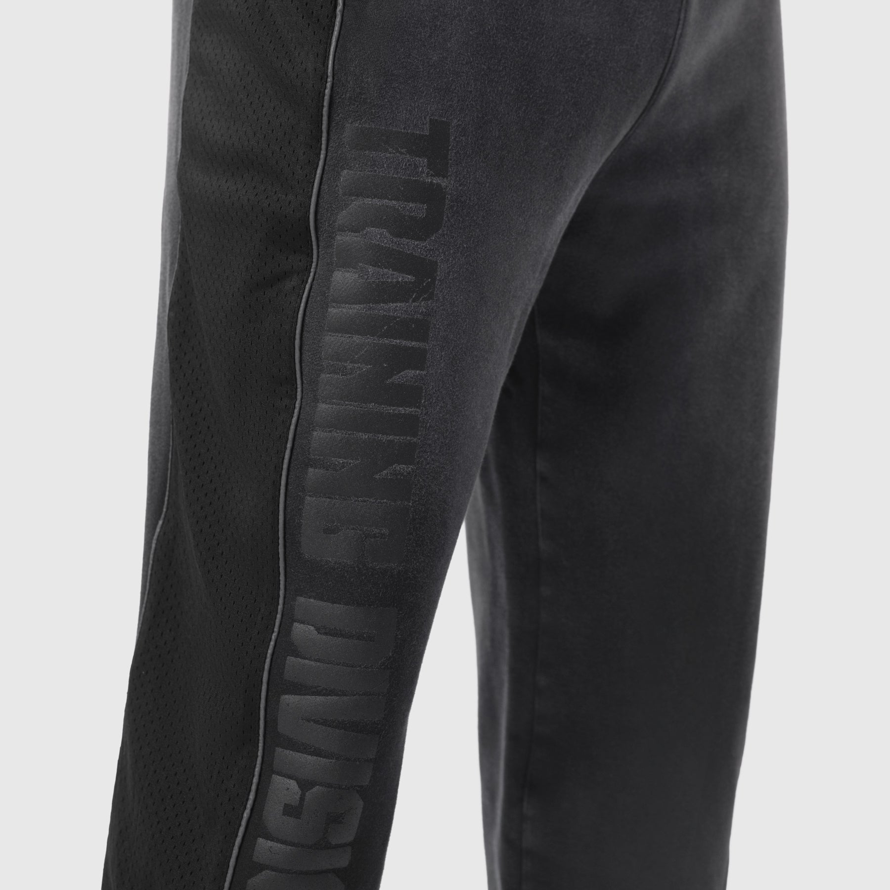 Tech-Terry Mesh Panel Sweats in black, worn on model showing side leg detail
