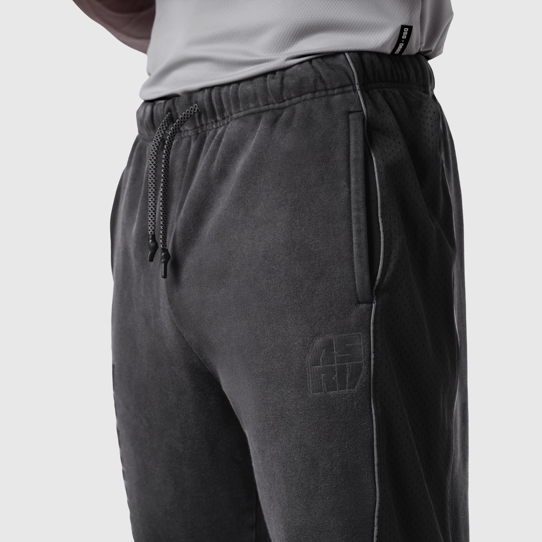 Black Tech-Terry Mesh Panel Sweats worn by model, side view detail of pocket and drawstring