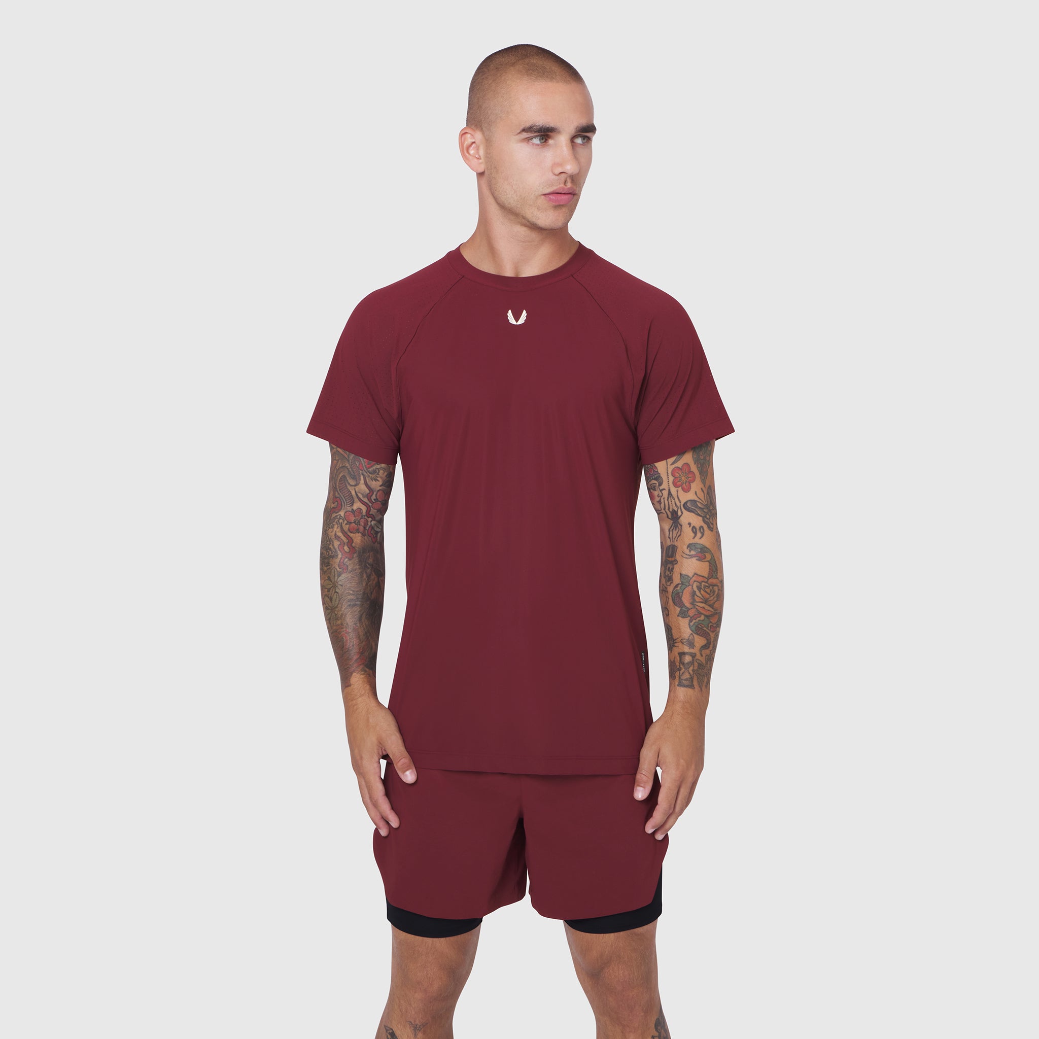 Laser-Vent Training Tee in crimson, worn by model with matching shorts, front view