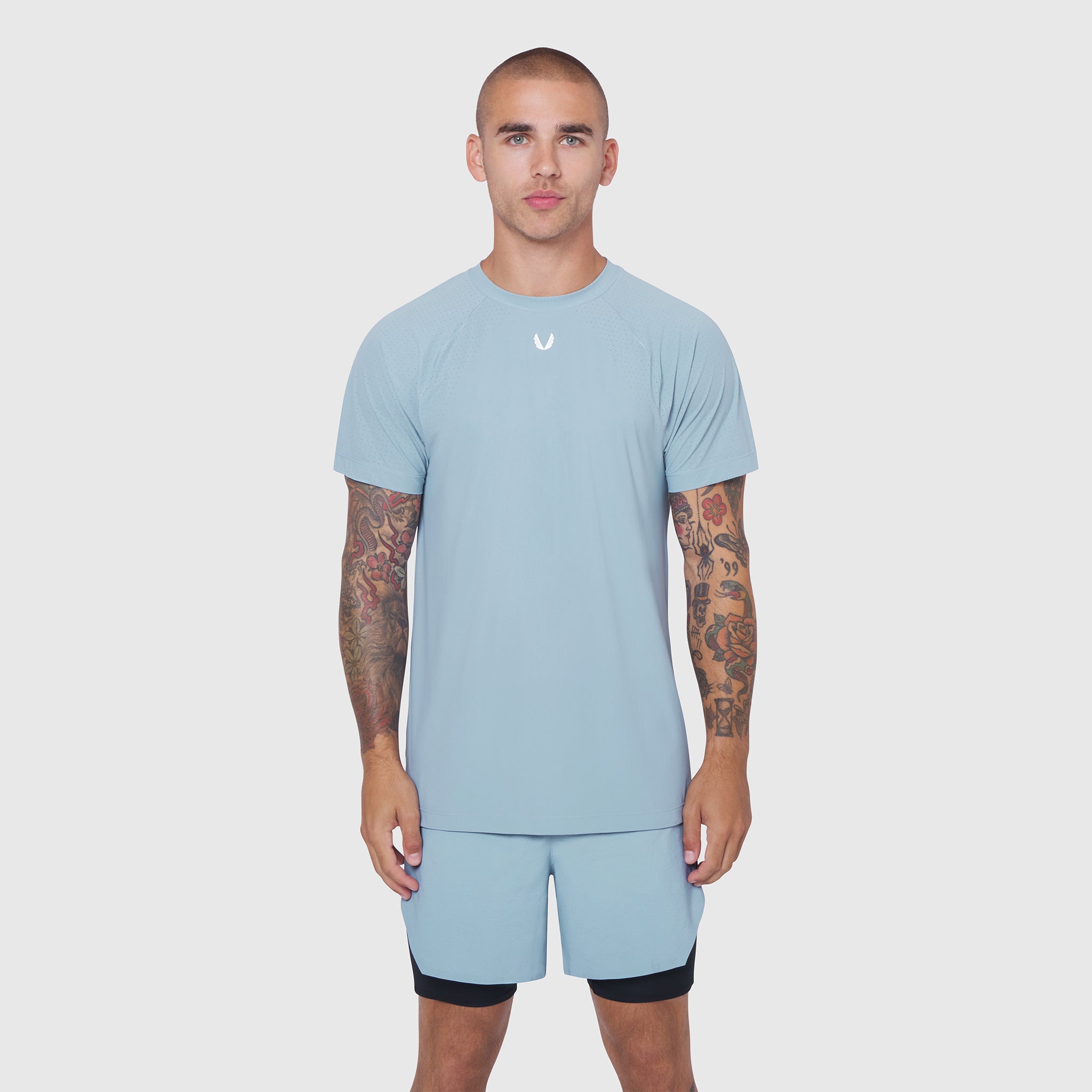 Light Sky Laser-Vent Training Tee worn with matching shorts, front view on model