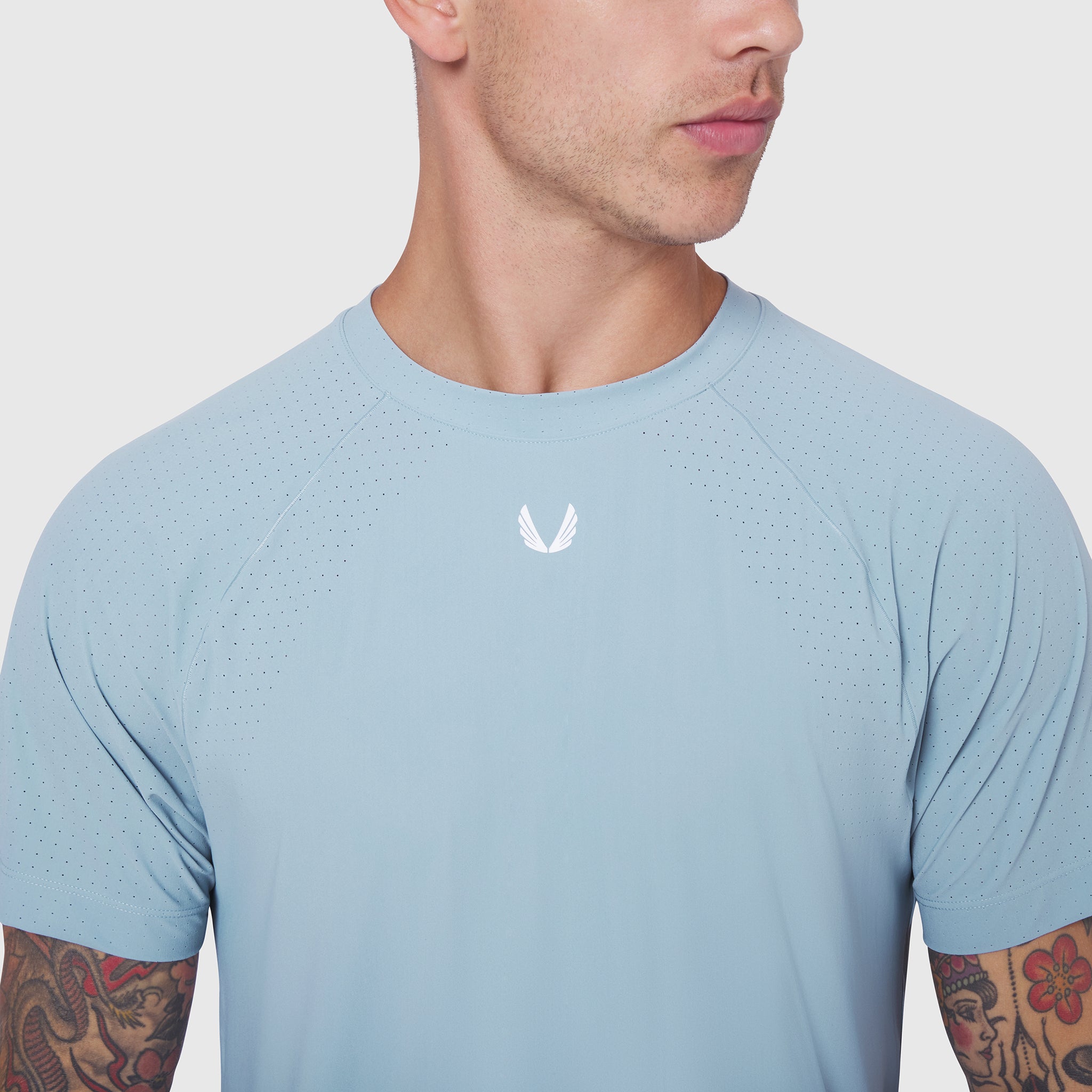 Laser-Vent Training Tee in Light Sky worn by male model, front view