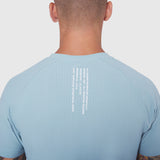 Light Sky Laser-Vent Training Tee worn by model, back view showing perforated fabric detail