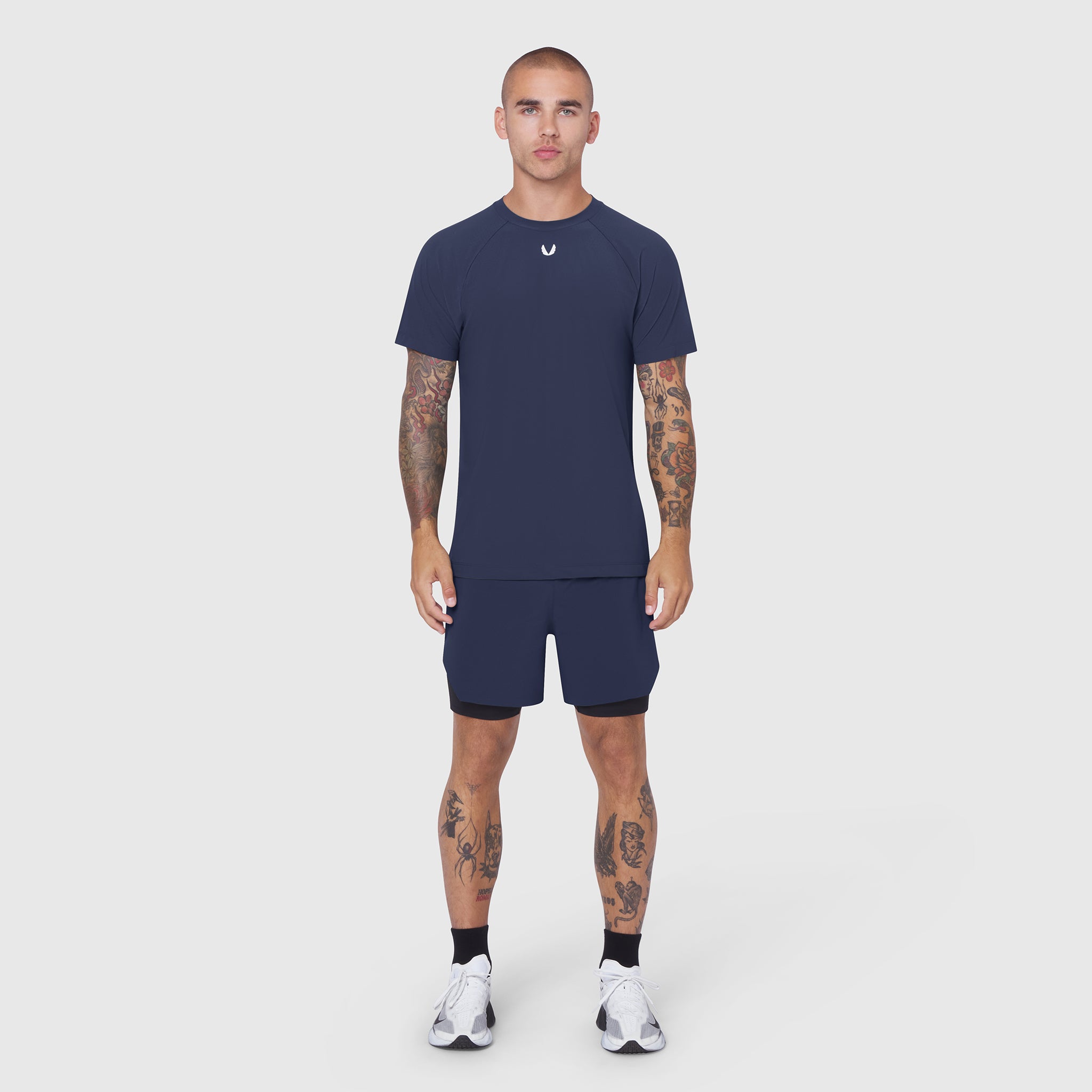 Laser-Vent Training Tee in navy worn with matching shorts, front view on model
