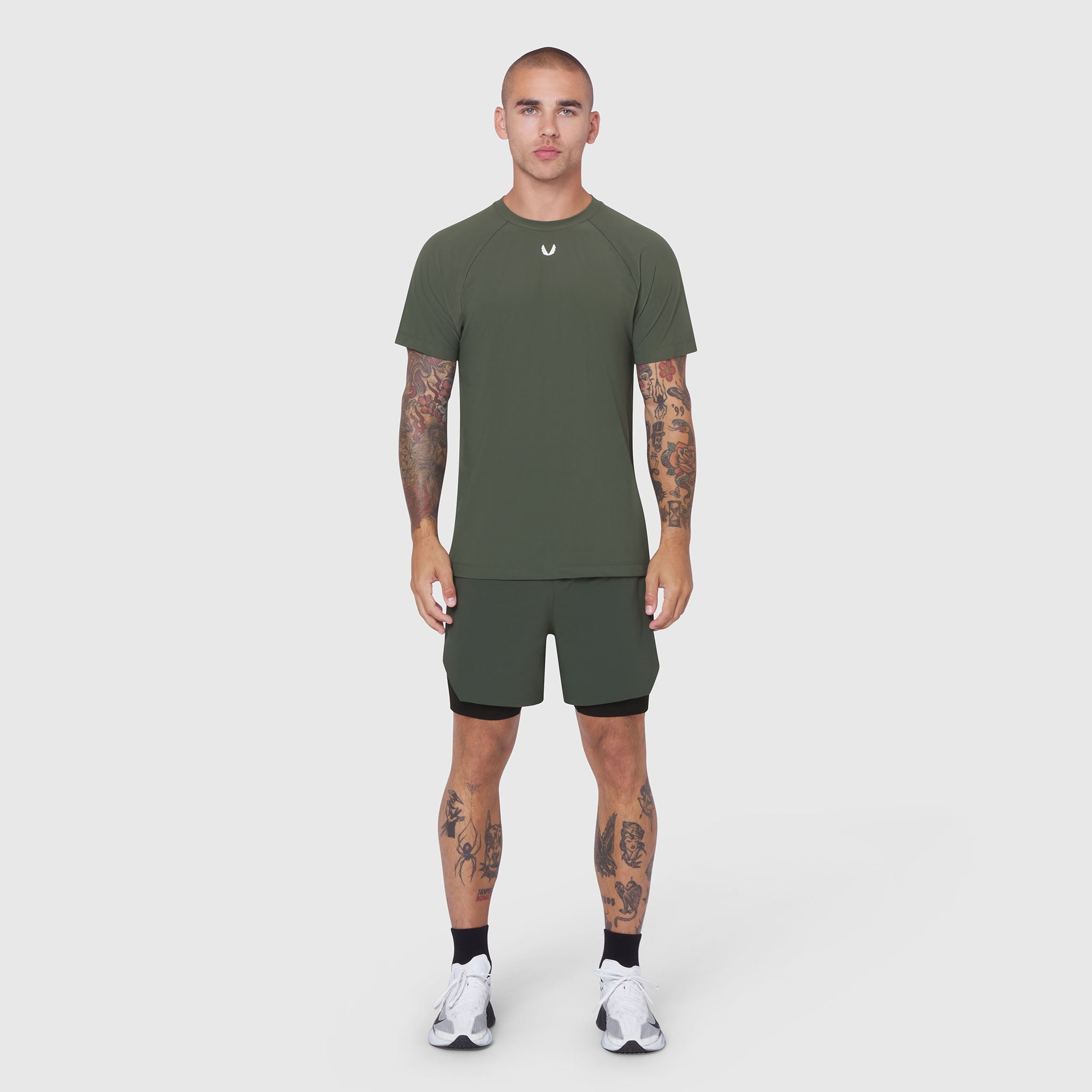 Laser-Vent Training Tee in olive worn with matching shorts, front view on model