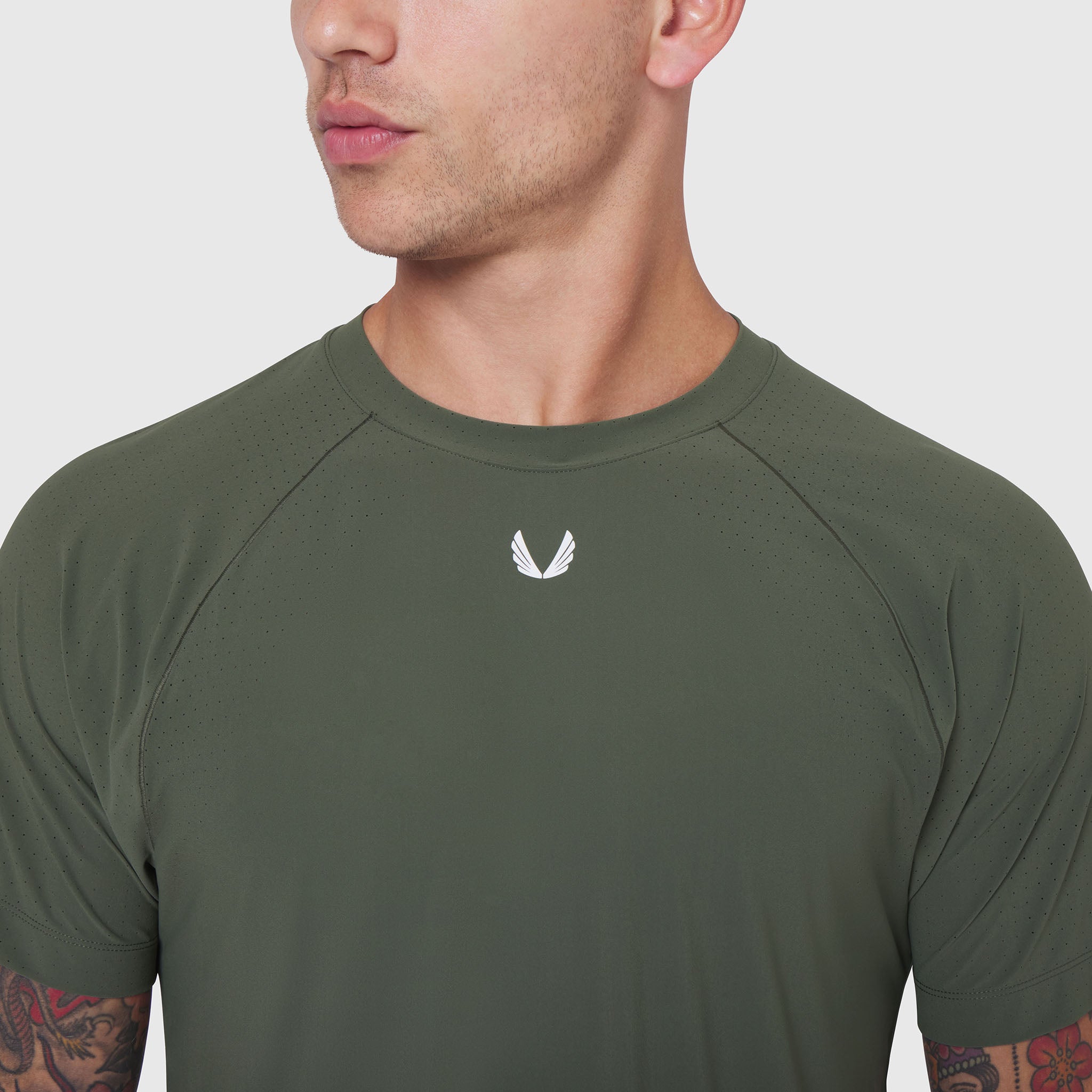 Laser-Vent™ Training Tee in olive worn by male model, front view