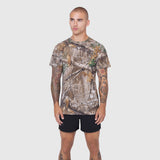 Laser-Vent Training Tee in Realtree Edge camo, worn by model with black shorts