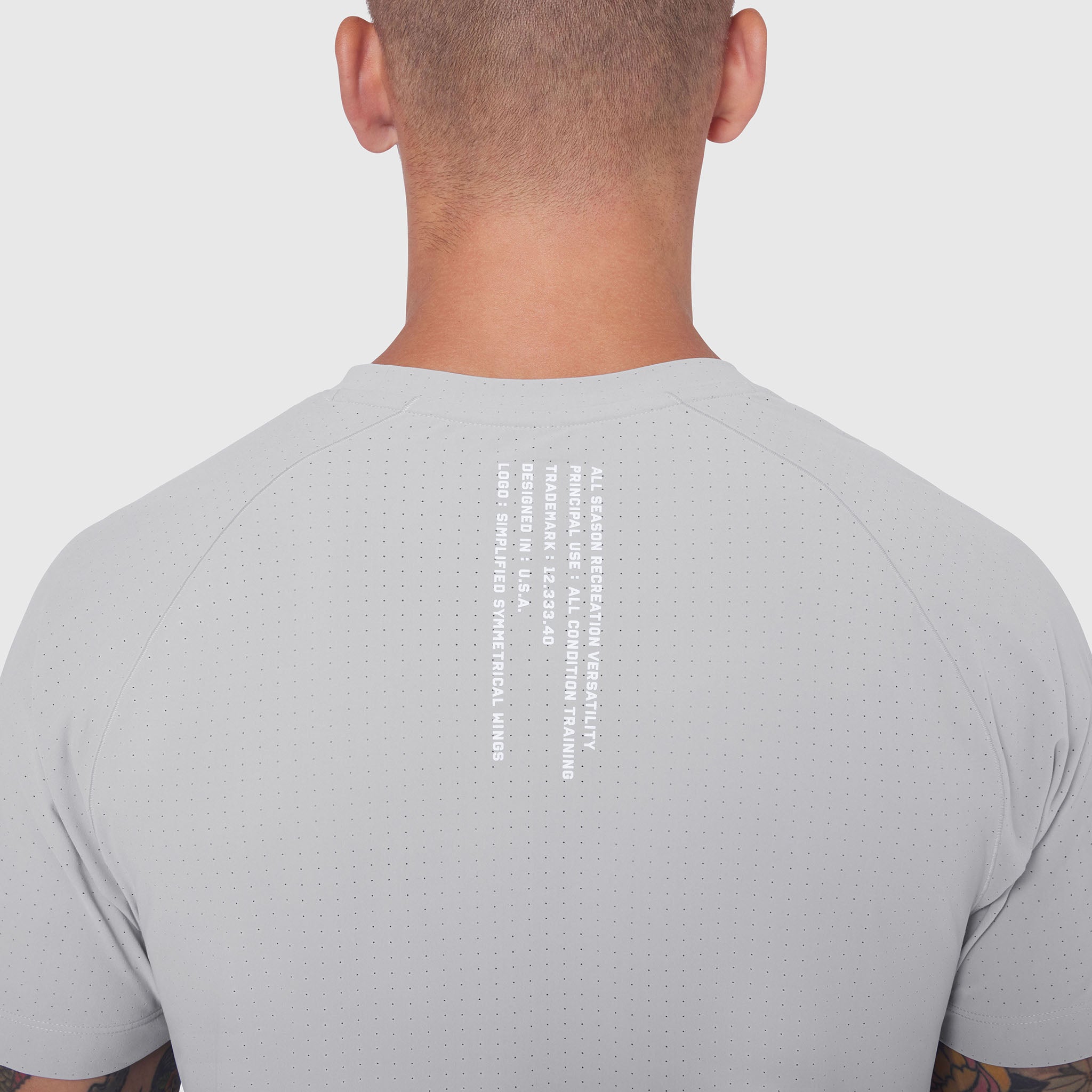 Laser-Vent™ Training Tee in Slate Grey, back view on model showing perforated fabric detail