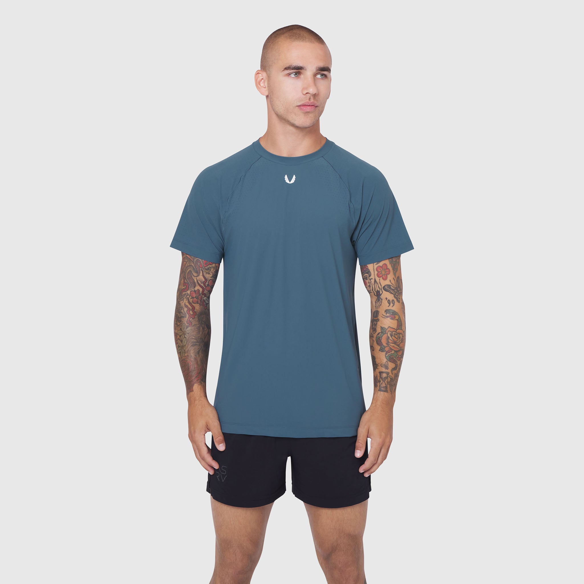 Laser-Vent Training Tee in storm blue, worn by male model with arms at sides