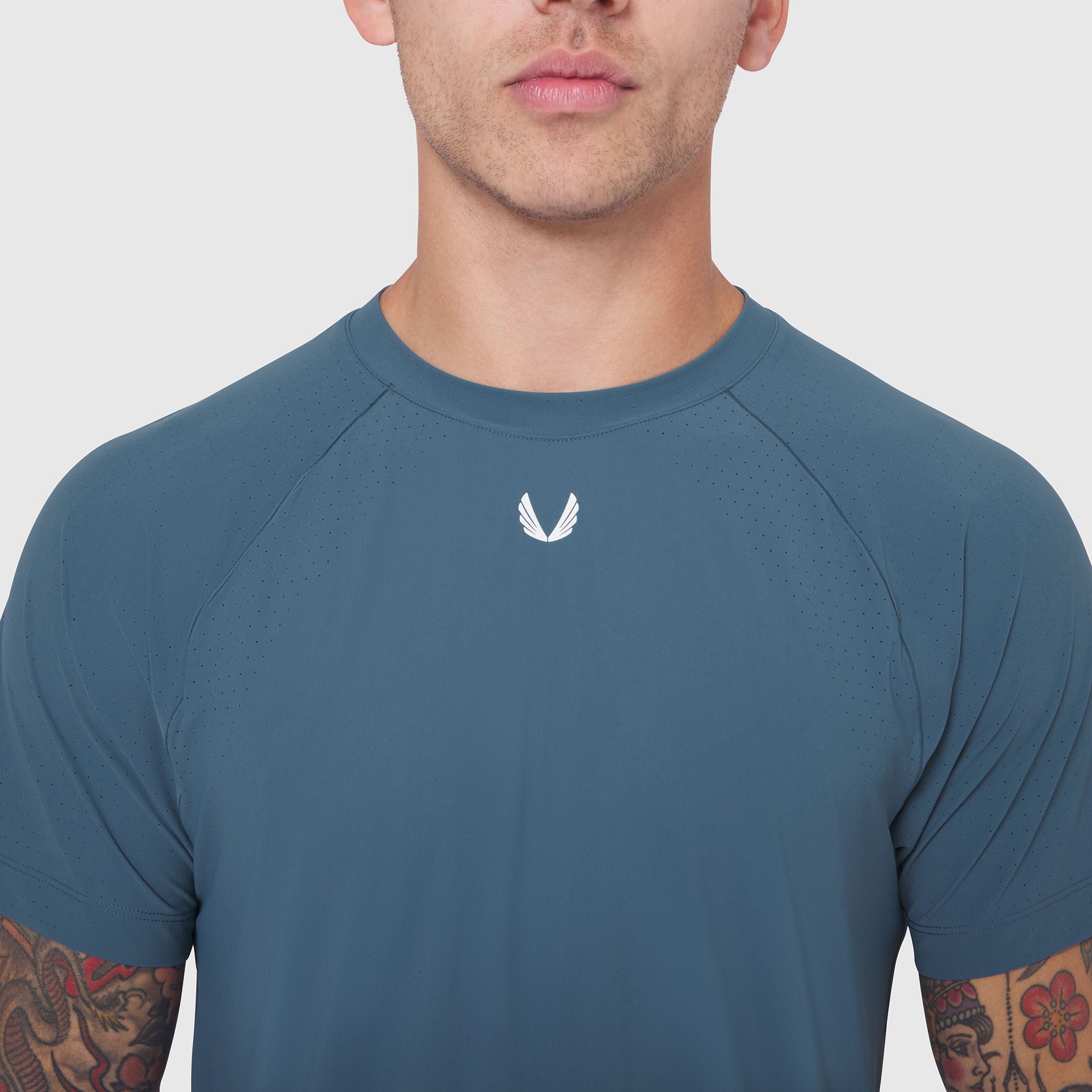 Laser-Vent Training Tee in storm blue worn by male model, front view