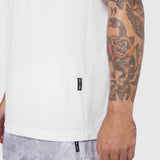 White Laser-Vent Training Tee worn by model showing side view, highlighting perforated fabric detail