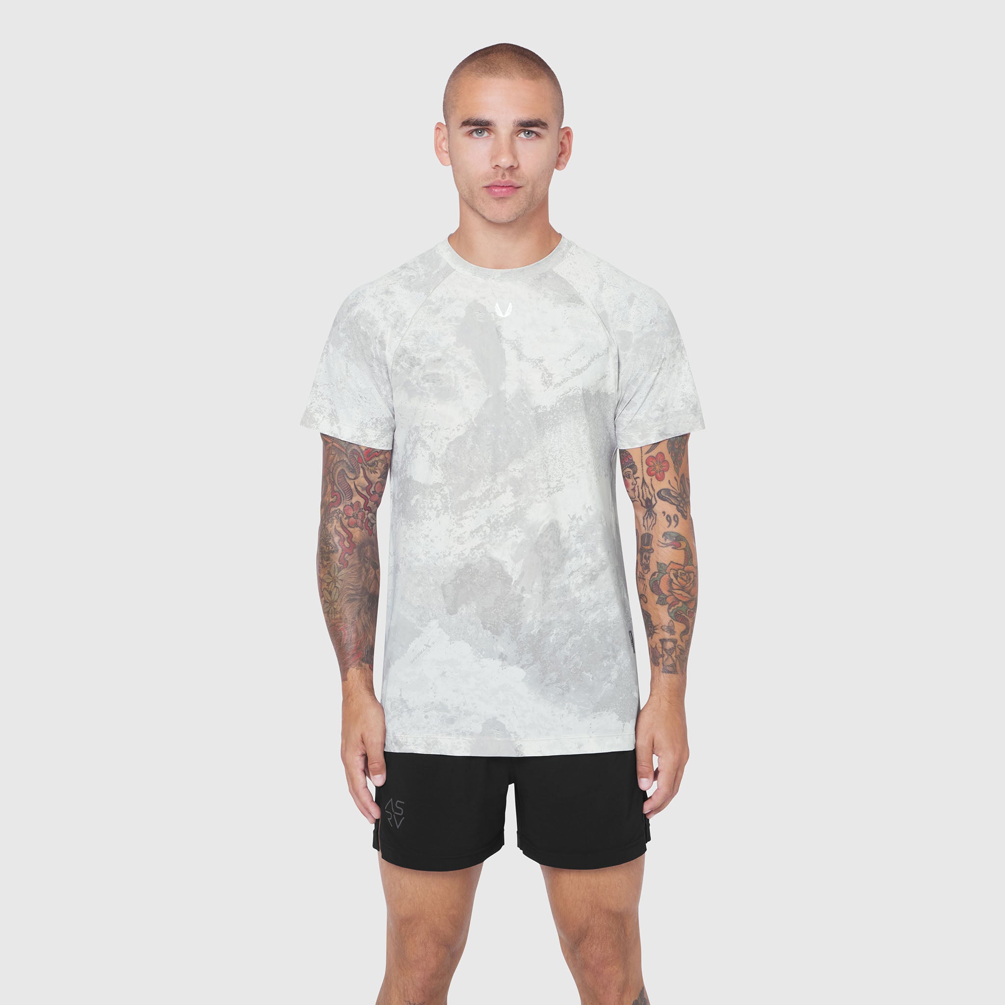Laser-Vent Training Tee in white camo, front view on model with black shorts