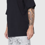 Black Supima Ice-Skin reversible tee on model, side view showing sleeve and fit