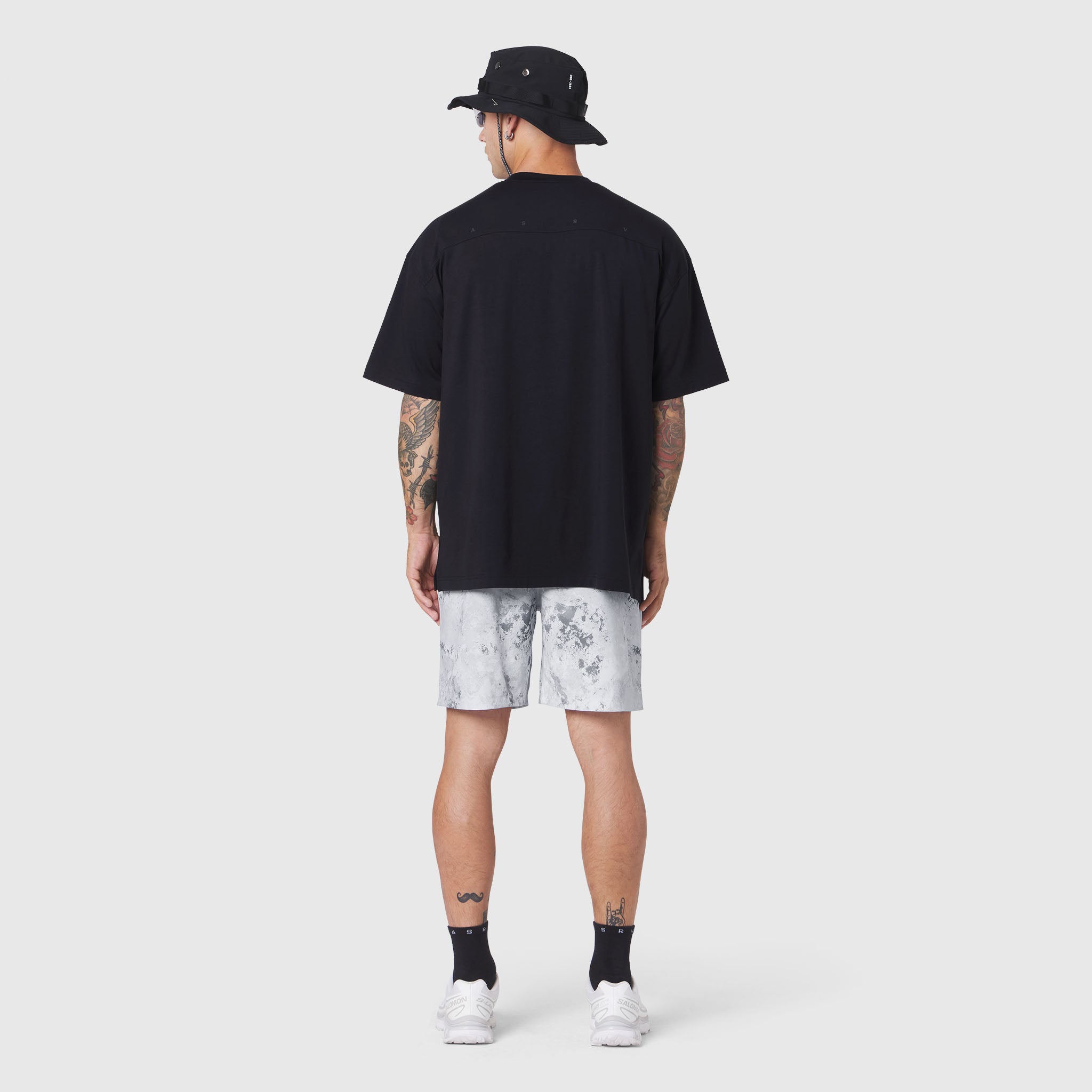 Black SUPIMA® Ice-Skin™ Reversible Tee worn with light tie-dye shorts, back view