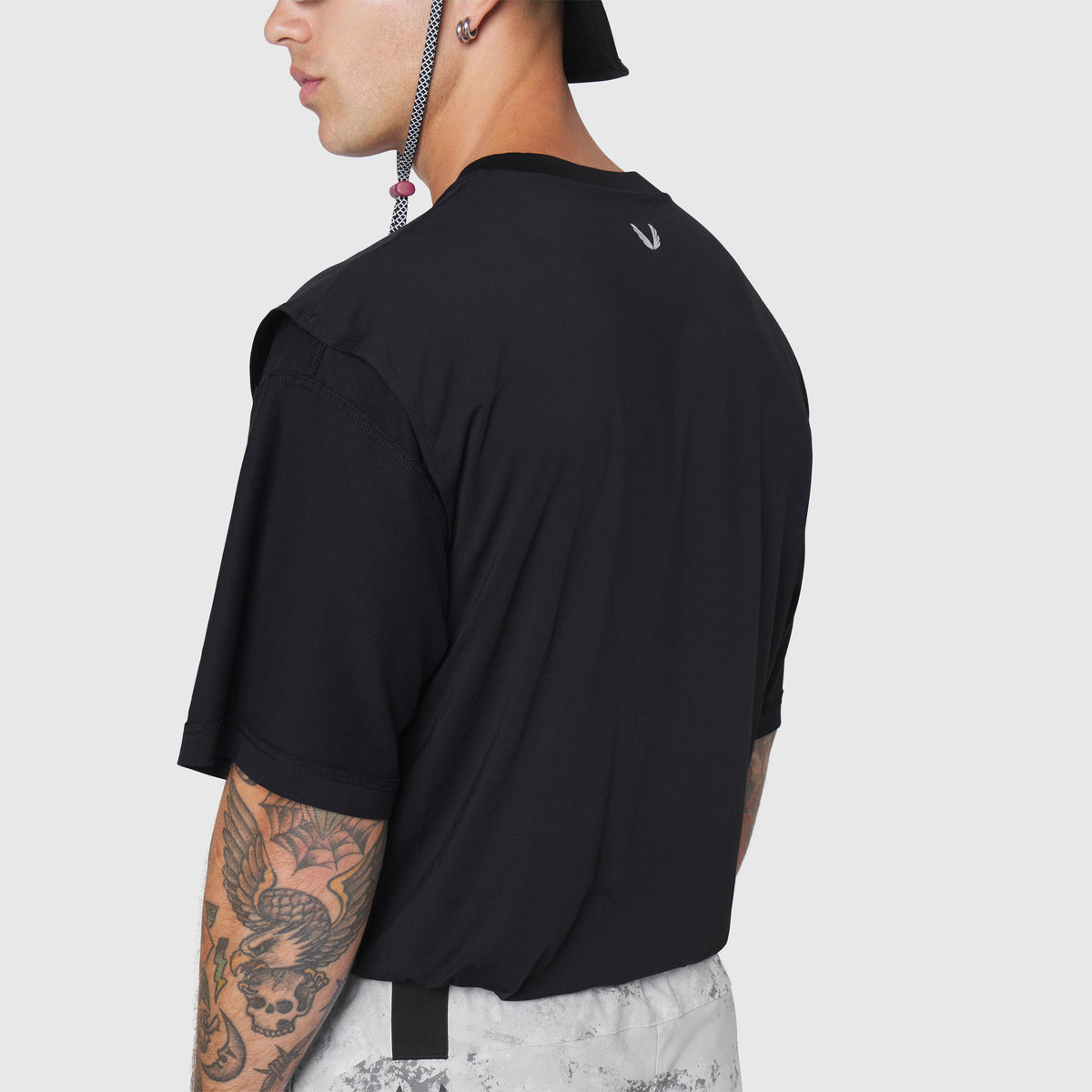 Black Supima Ice-Skin reversible tee on model, back view