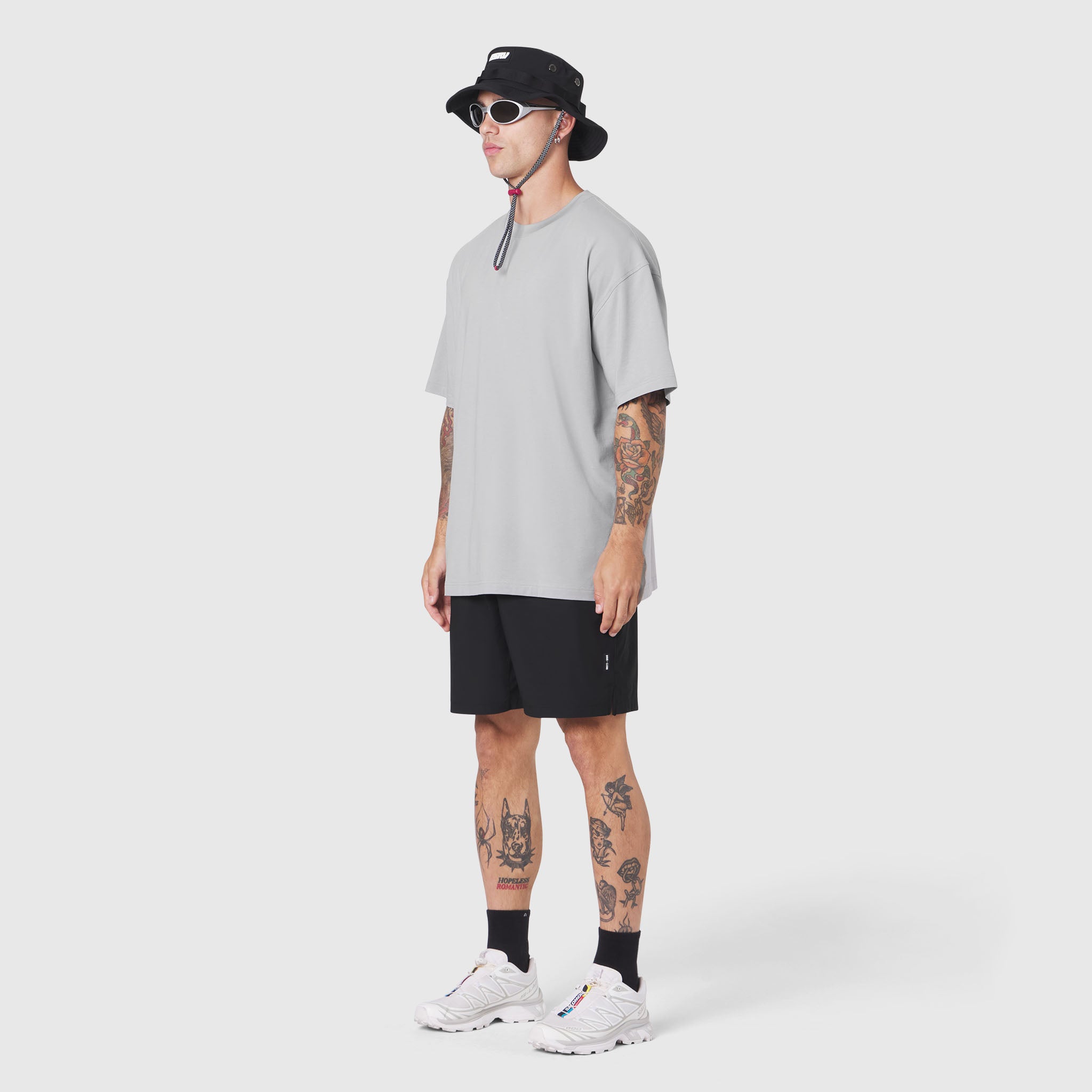Supima Ice-Skin Reversible Tee in slate grey worn by model with black shorts, side view
