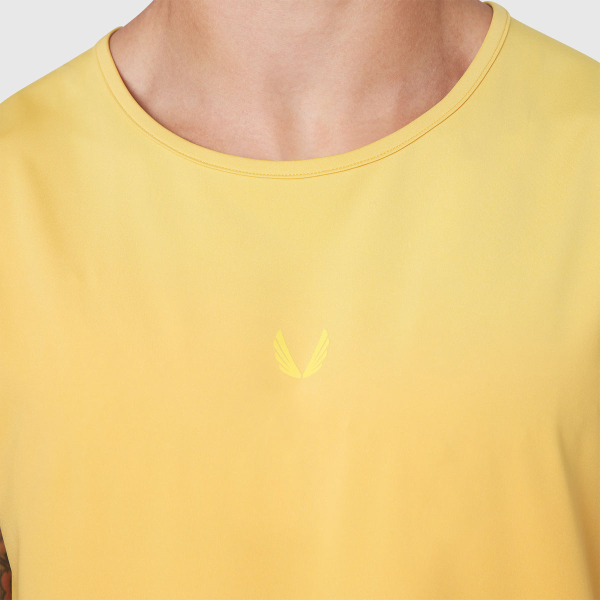 Warpflexx-Lite Training Tank in amber yellow worn by model, front view