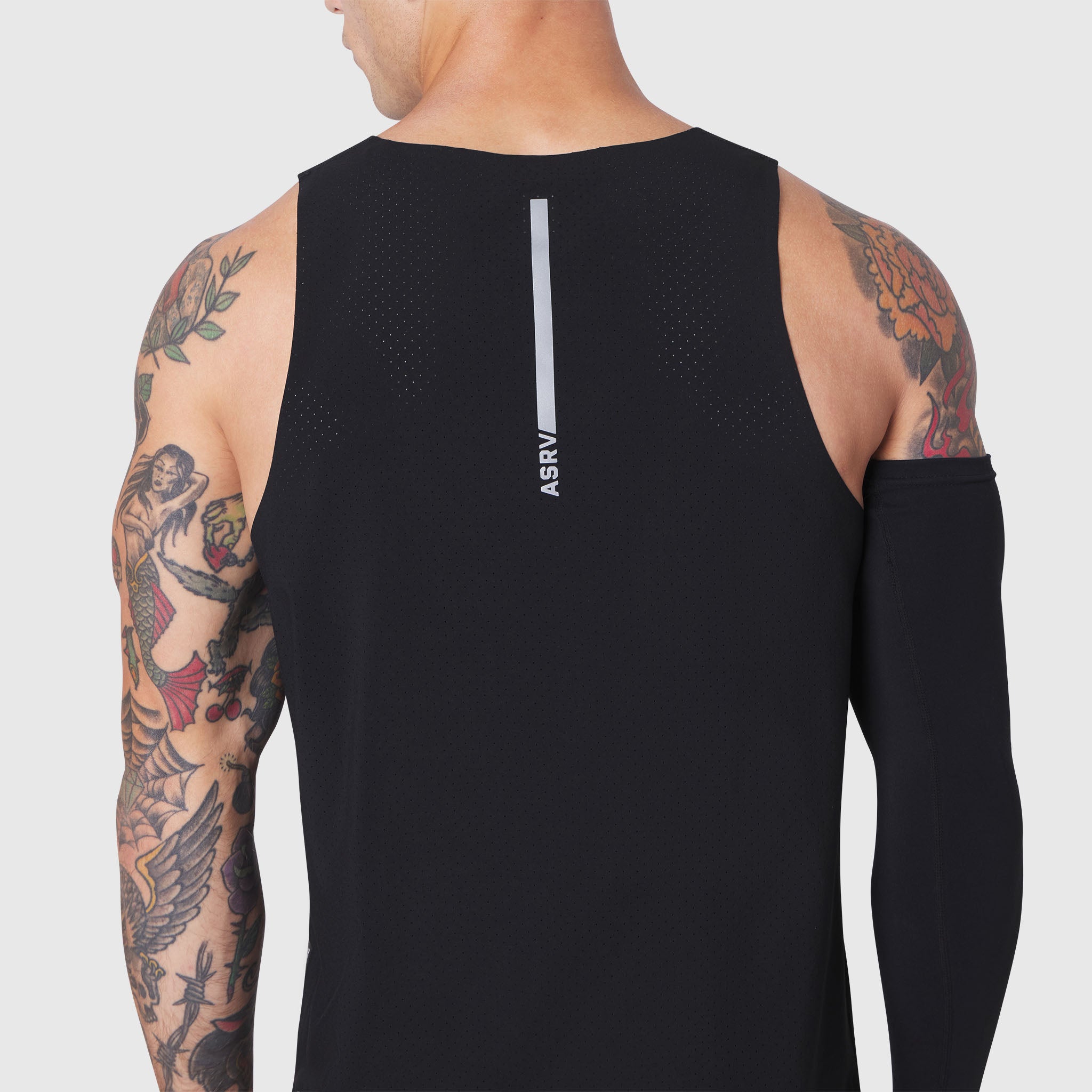 Aerotex Perforated Run Tank in black, rear view on model with tattoos