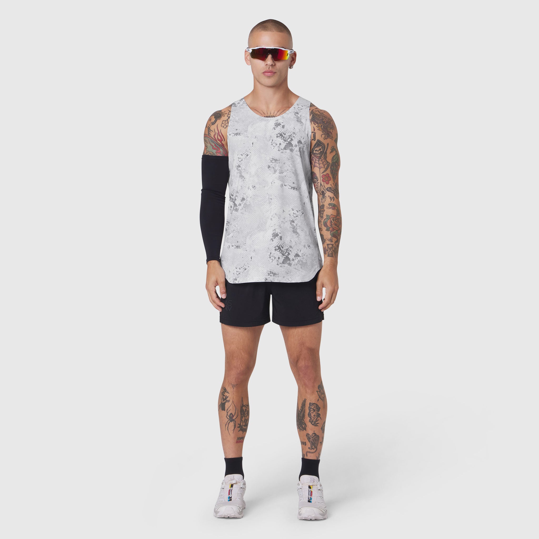 Aerotex Perforated Run Tank in Sedona Snow Camo worn with black shorts, front view