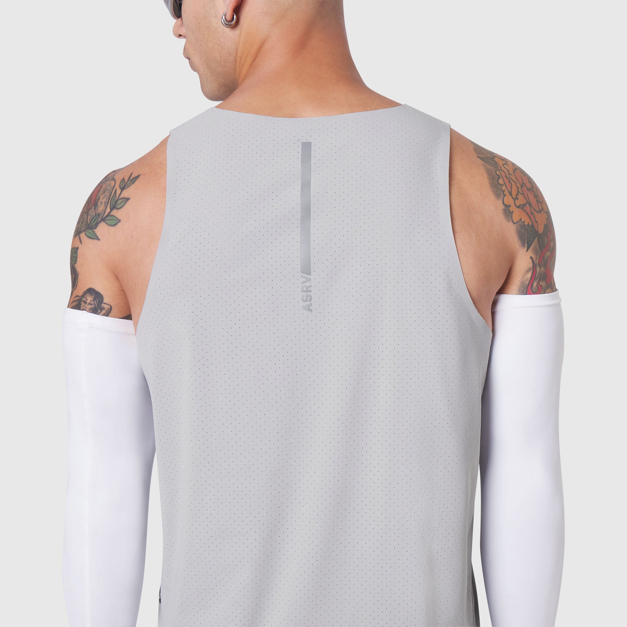 Aerotex Perforated Run Tank in slate grey, back view worn by model with arm sleeves