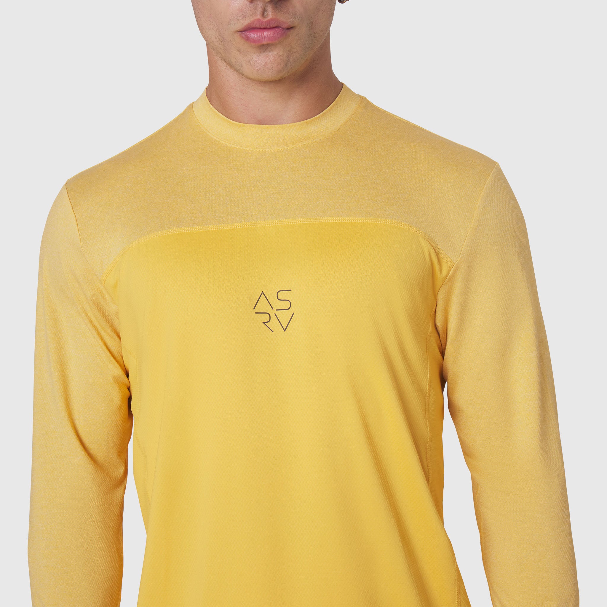 AEROSILVER® UPF50+ Run Long Sleeve in amber, worn by model, front view