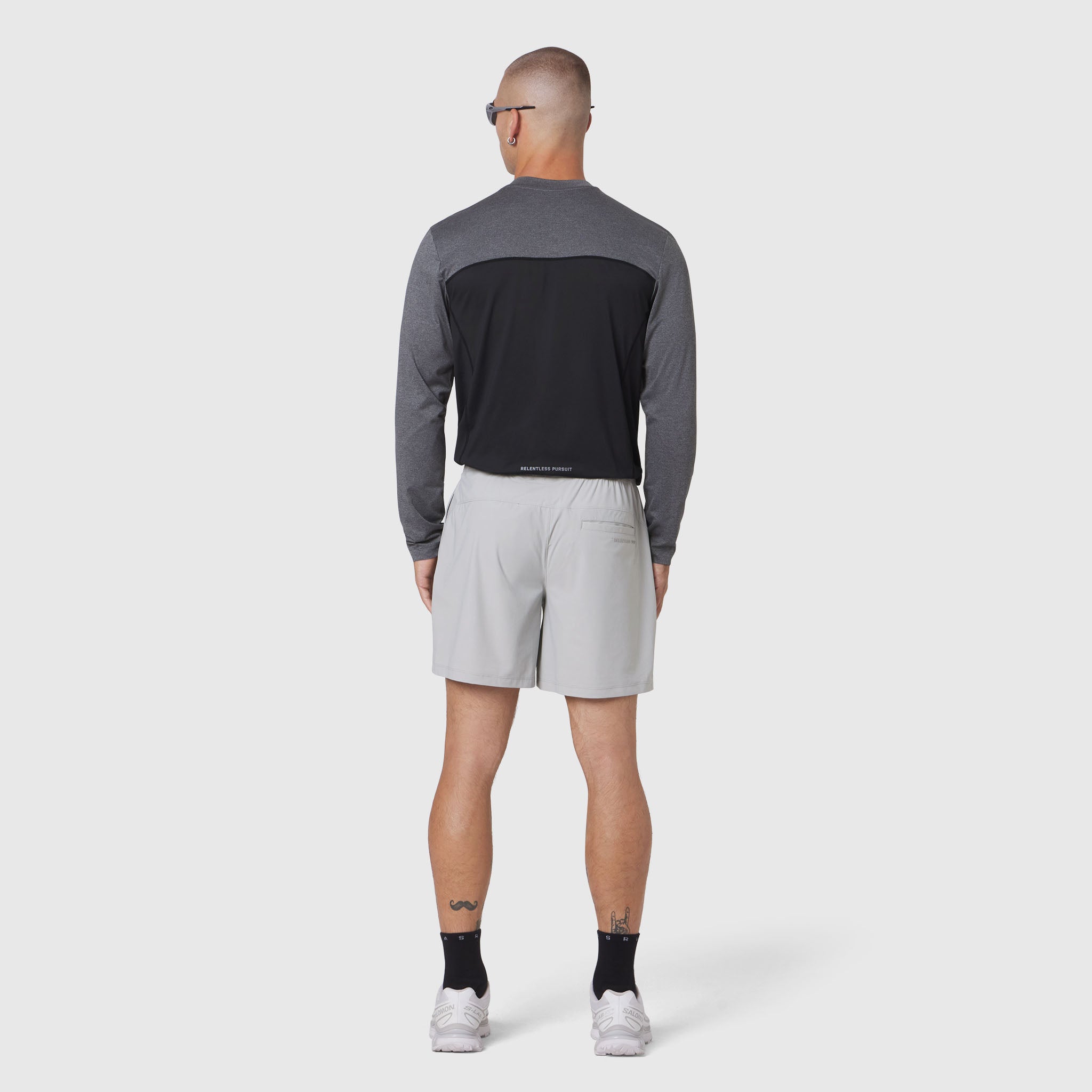 AEROSILVER® UPF50+ Run Long Sleeve in black and gray, worn by model from behind