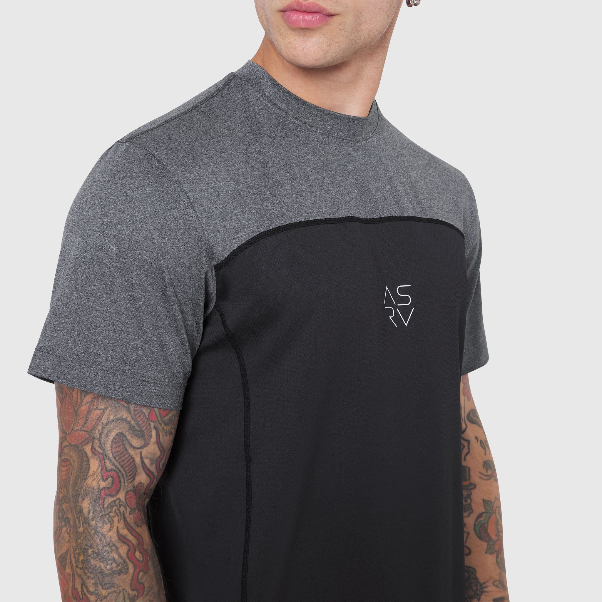 AEROSILVER® UPF50+ Run Tee in black and gray colorblock, worn by model showing front view
