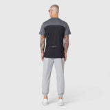 AEROSILVER UPF50+ Run Tee in black and gray colorblock, back view on model