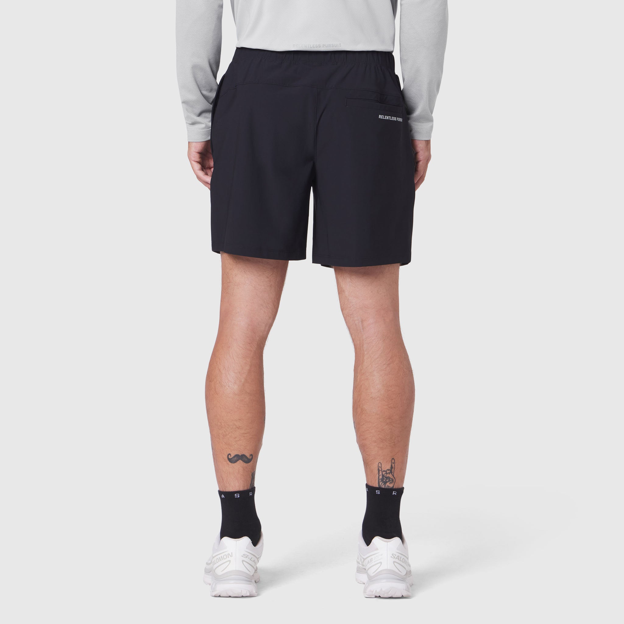 Black Revolutional Training Shorts worn by model, back view