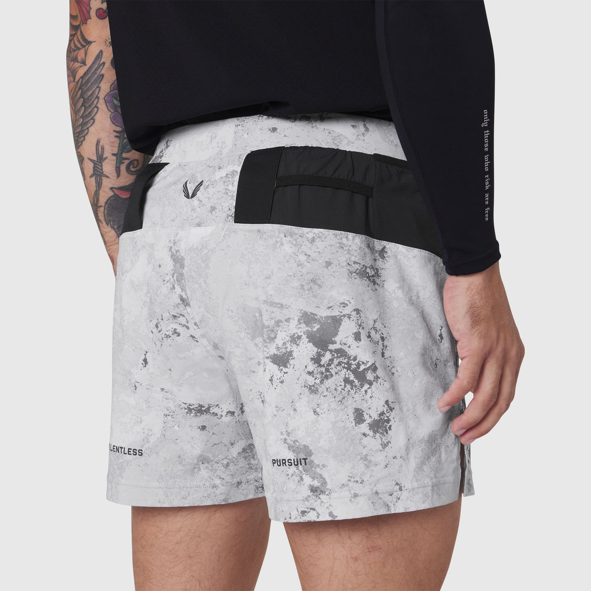 Aerotex Distance Run Short in Sedona Snow Camo worn by model, back view