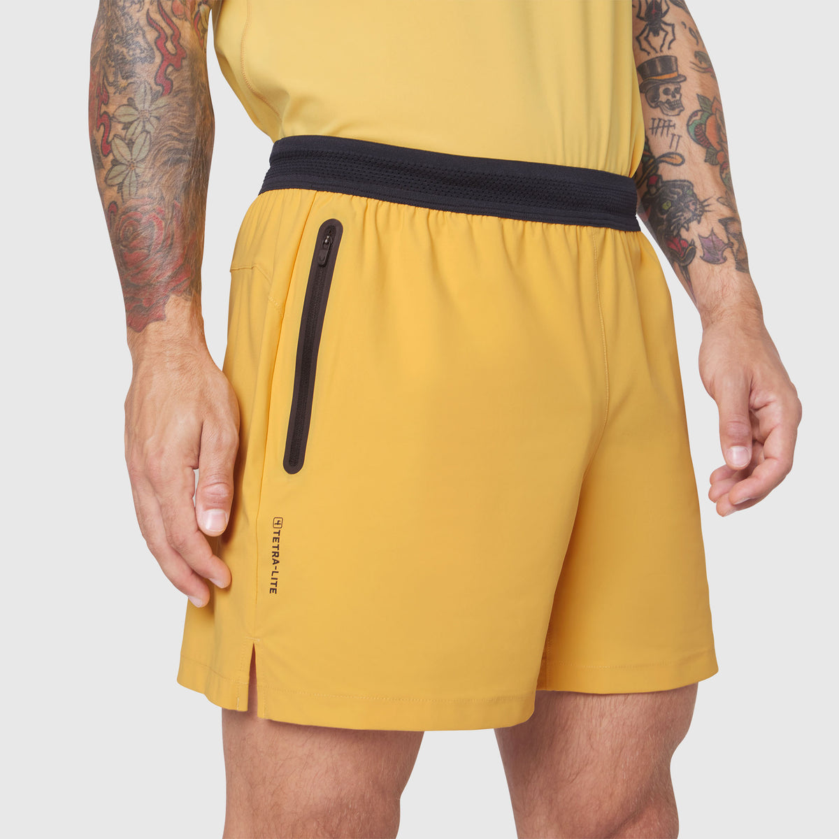 TETRA-LITE® 5" Linerless Training Short in Amber, worn by model showing side pocket detail