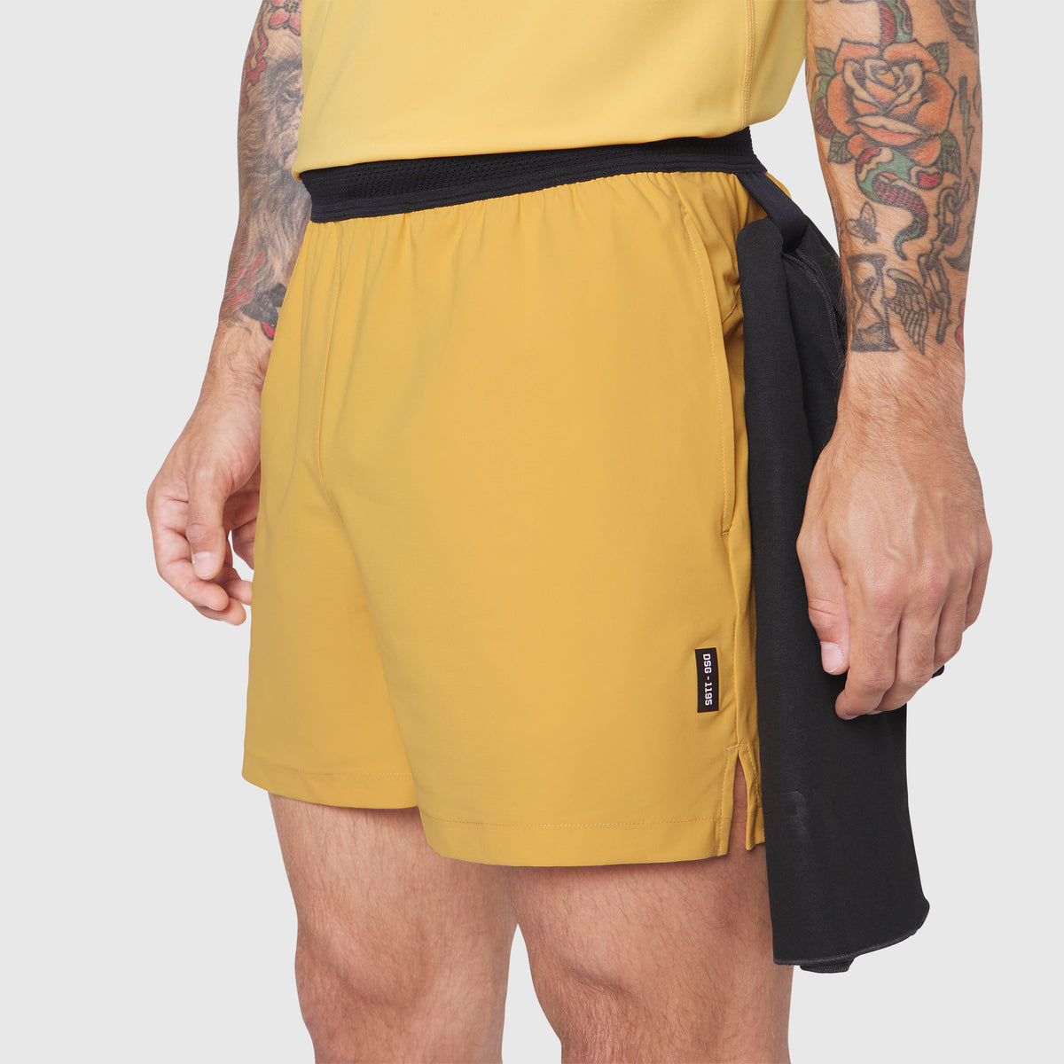 TETRA-LITE® 5" Linerless Training Short in amber and black, worn by model, side view