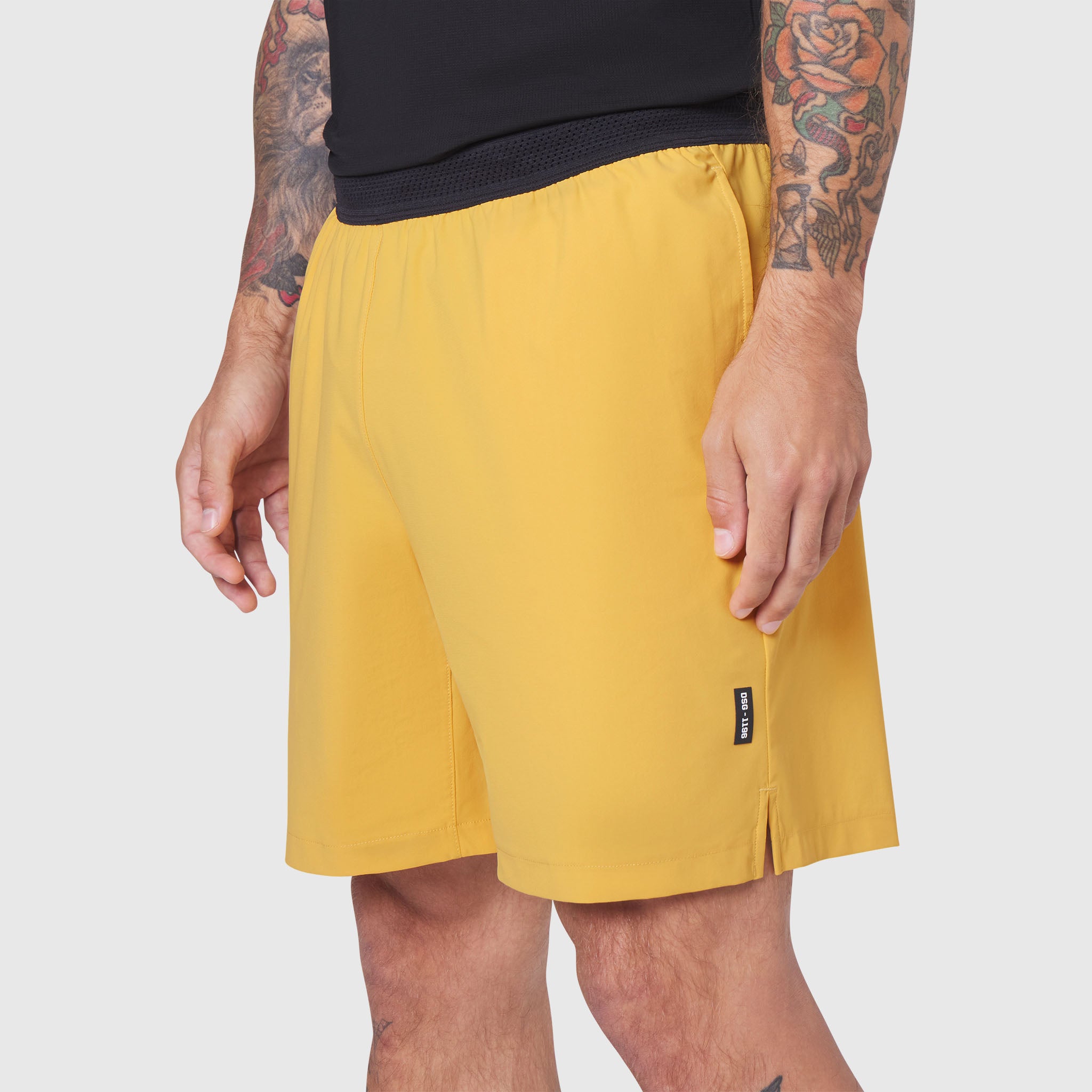 TETRA-LITE® 7" Linerless Training Short in amber yellow, worn by model, side view