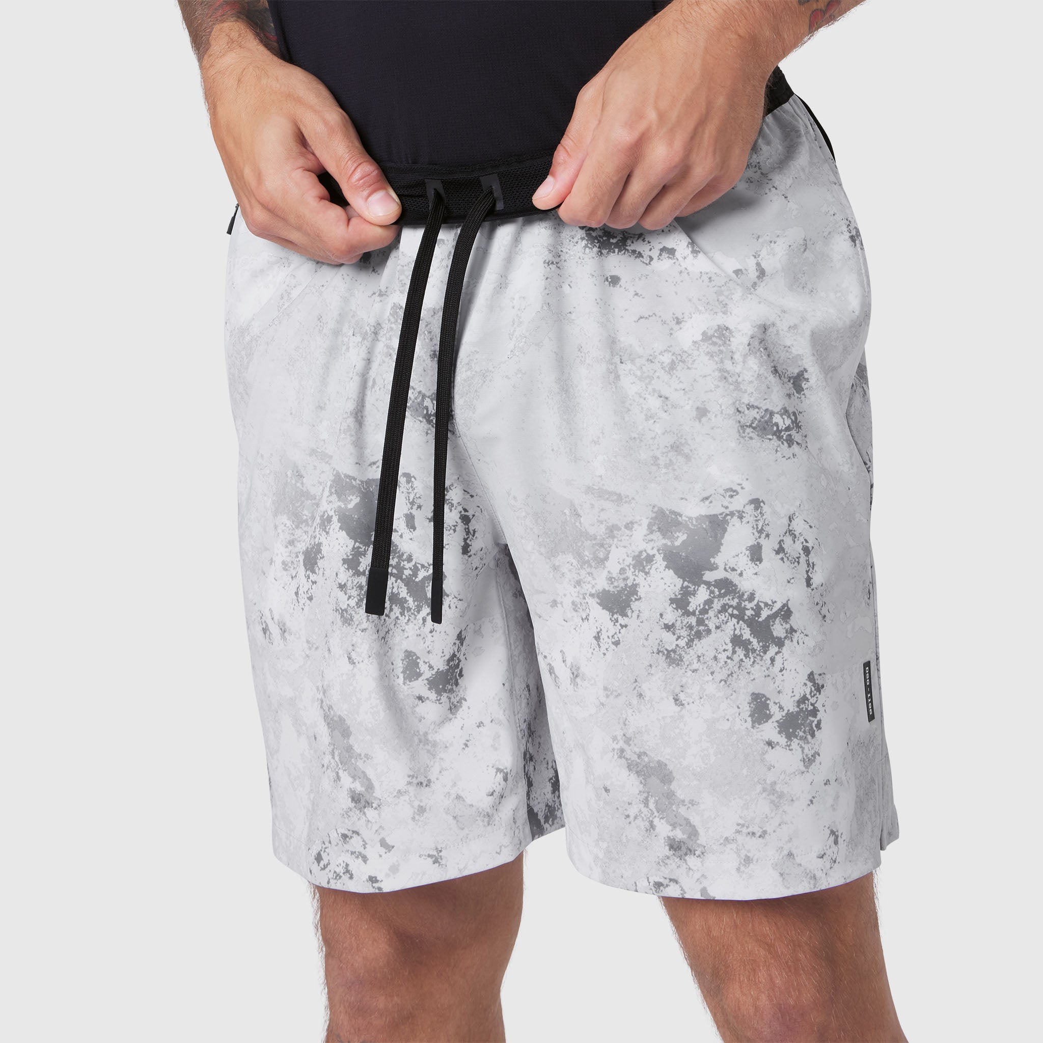 TETRA-LITE 7" Linerless Training Short in Sedona Snow Camo, model wearing shorts with drawstring detail