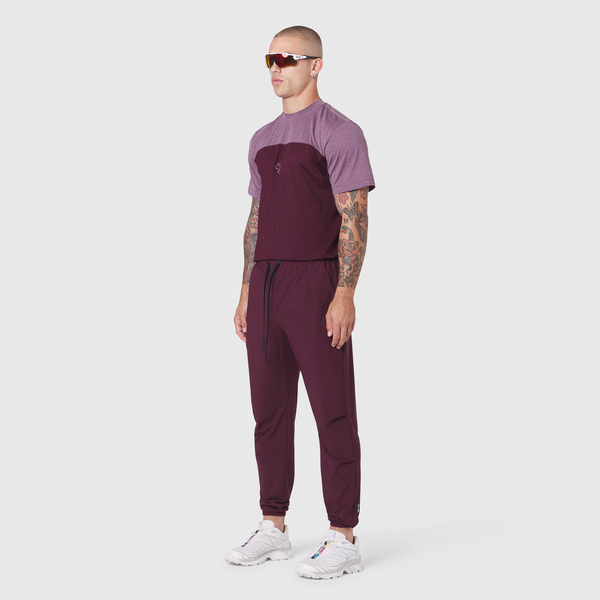 TETRA-LITE® Training Jogger in merlot, worn by model with colorblock tee, side view