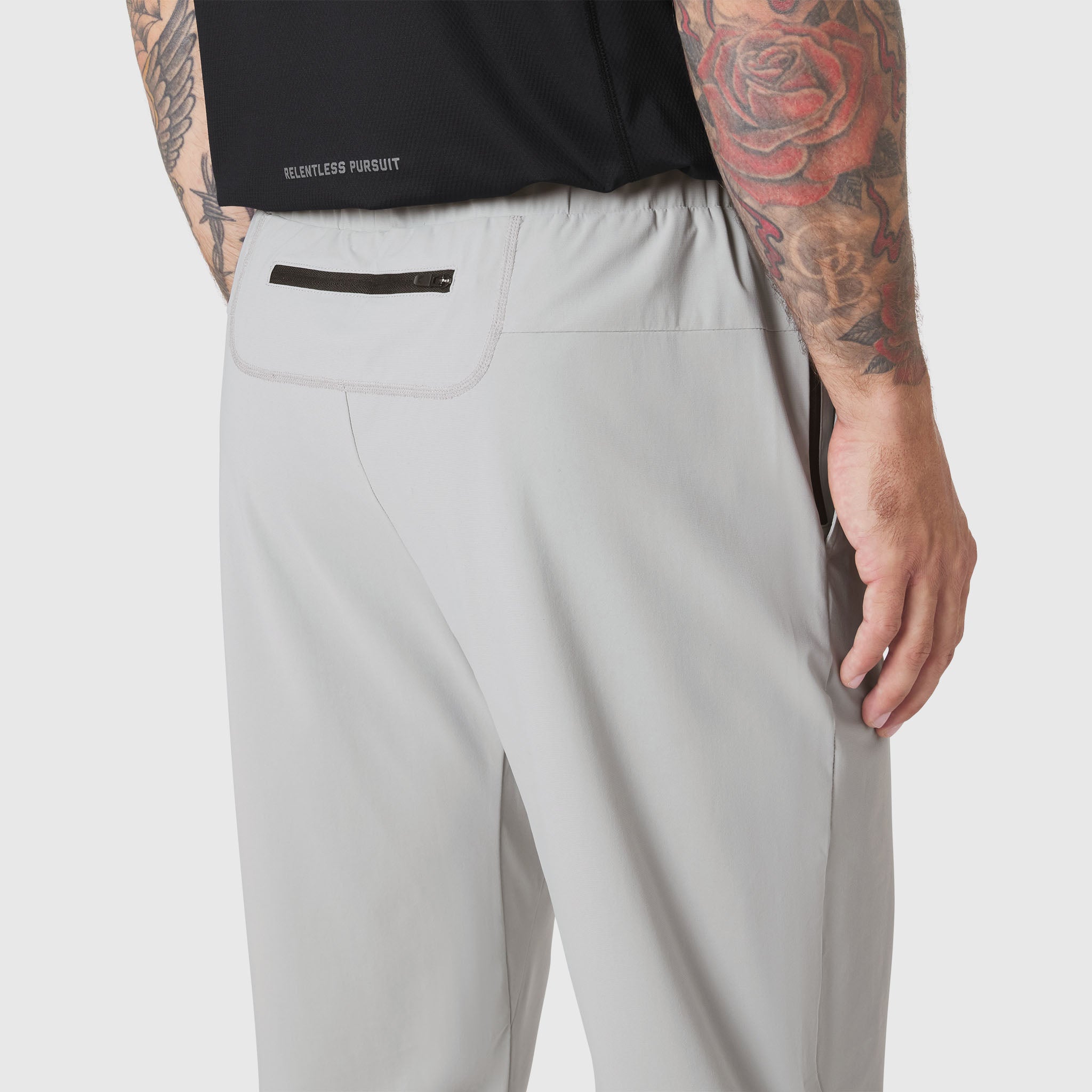 TETRA-LITE Training Jogger in slate grey worn by model, back pocket detail view