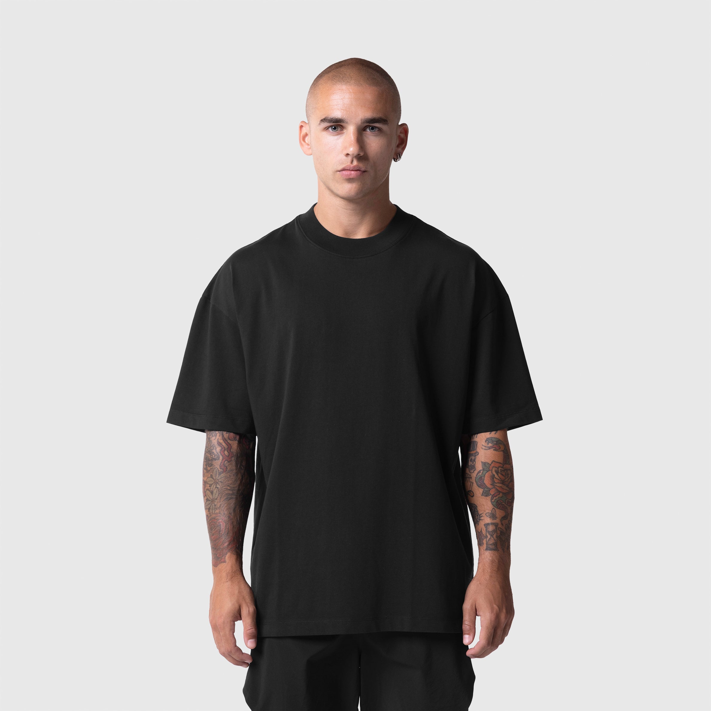 Model wearing ASRV Tech Essential™ Oversized Boxy Tee in black, front view