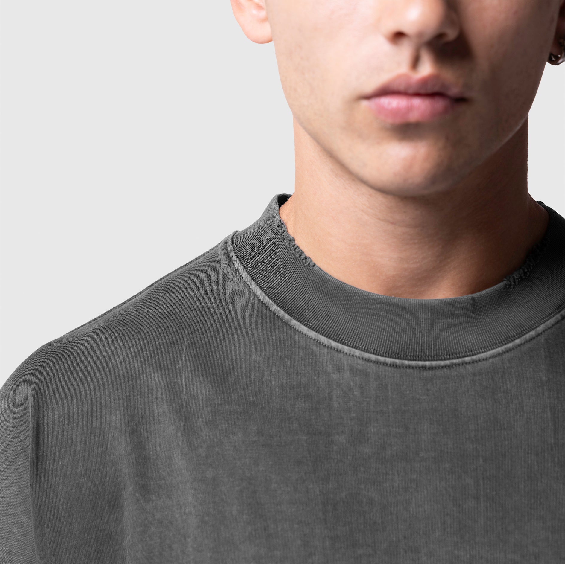 Model wearing Tech Essential™ Oversized Boxy Tee in Faded Grey, front view close-up