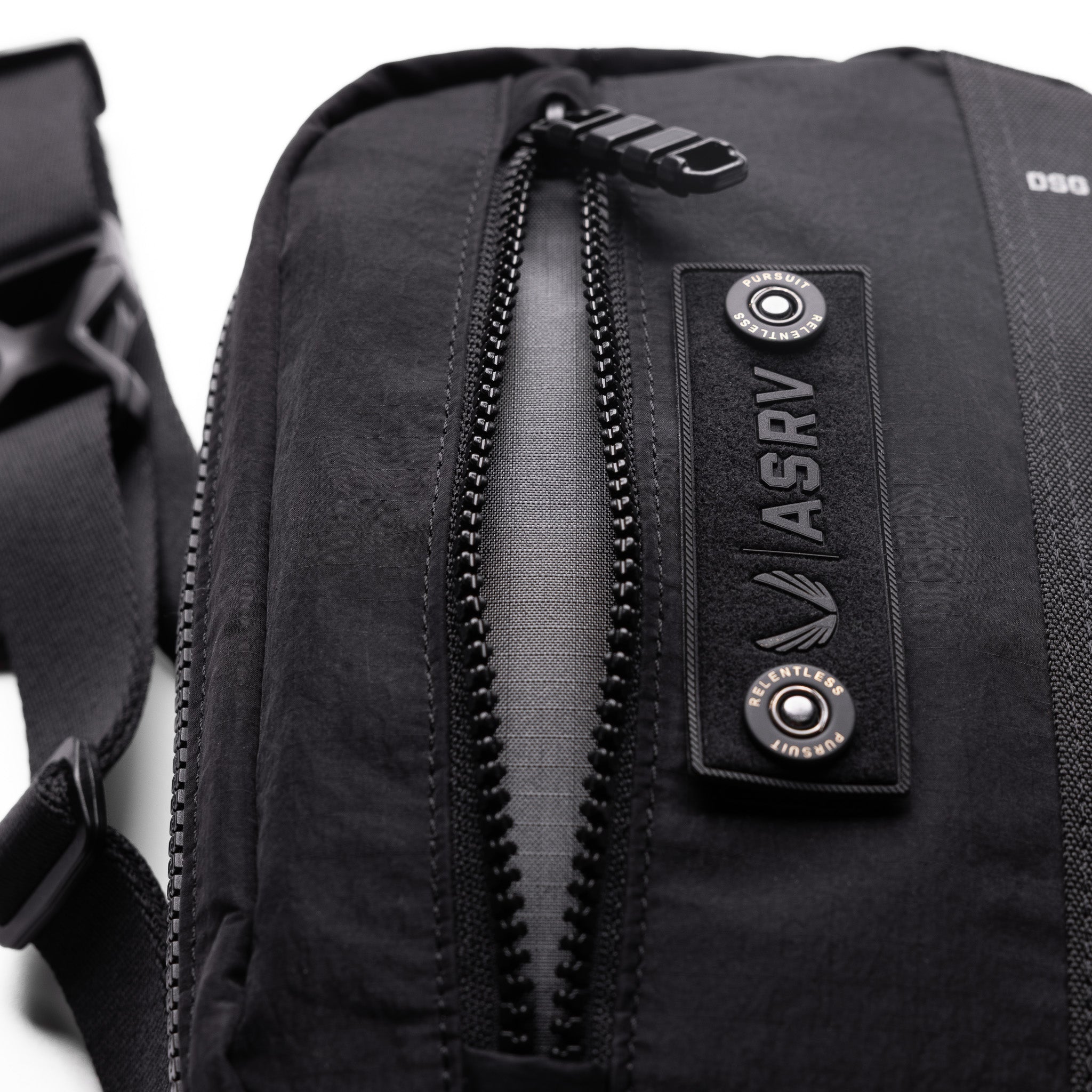 1231 Ripstop Crossbody Bag in black, worn and carried detail view