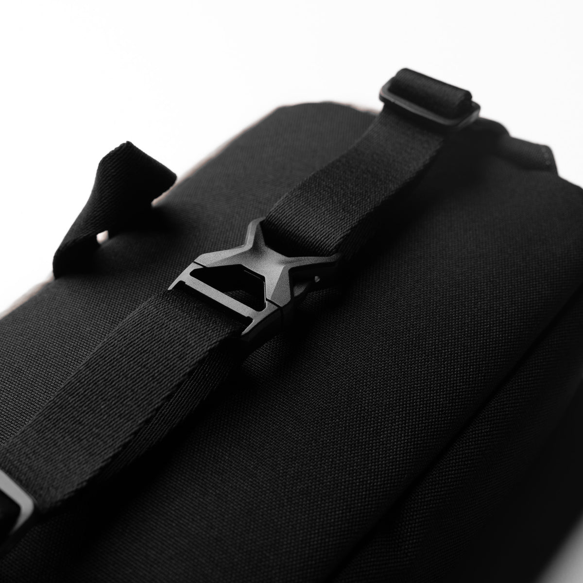Flatlay 1231. Ripstop Crossbody Bag in black, detail view of buckle