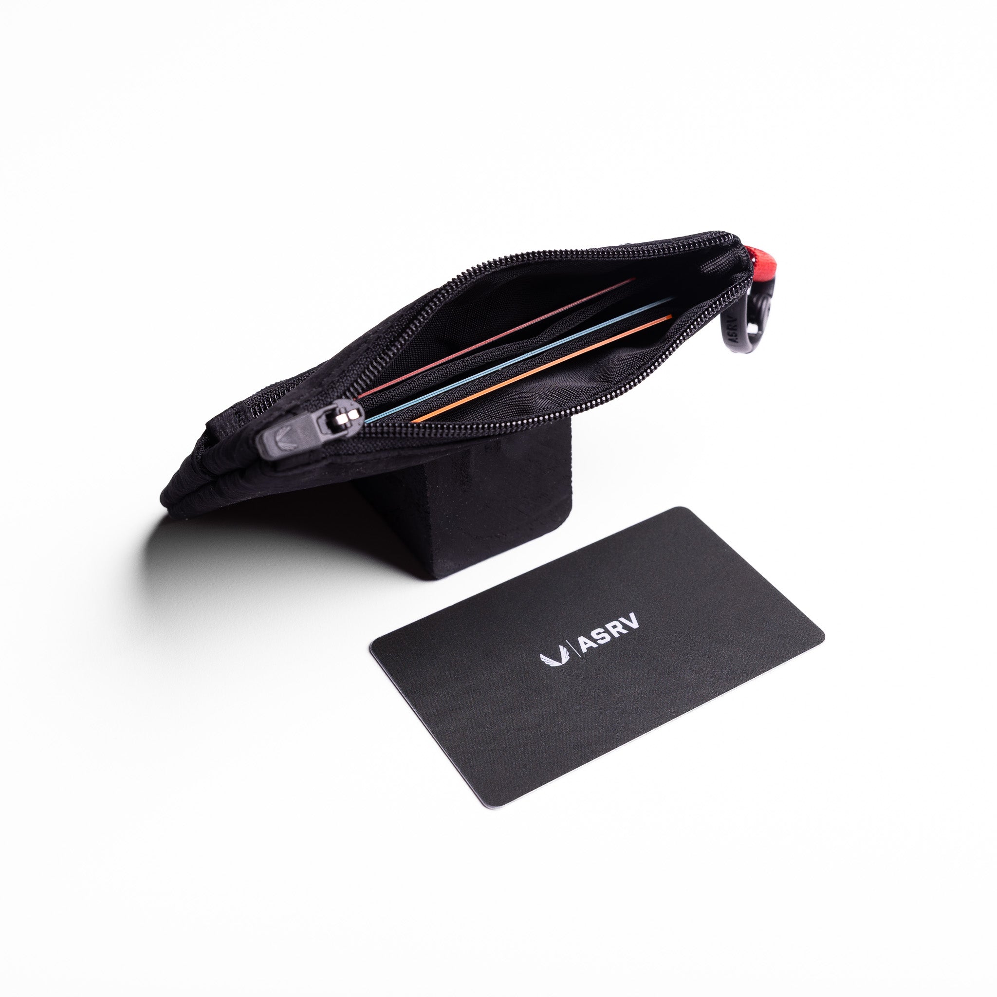 Flatlay 1235 Ripstop Clip Bag in black, open view with accessories