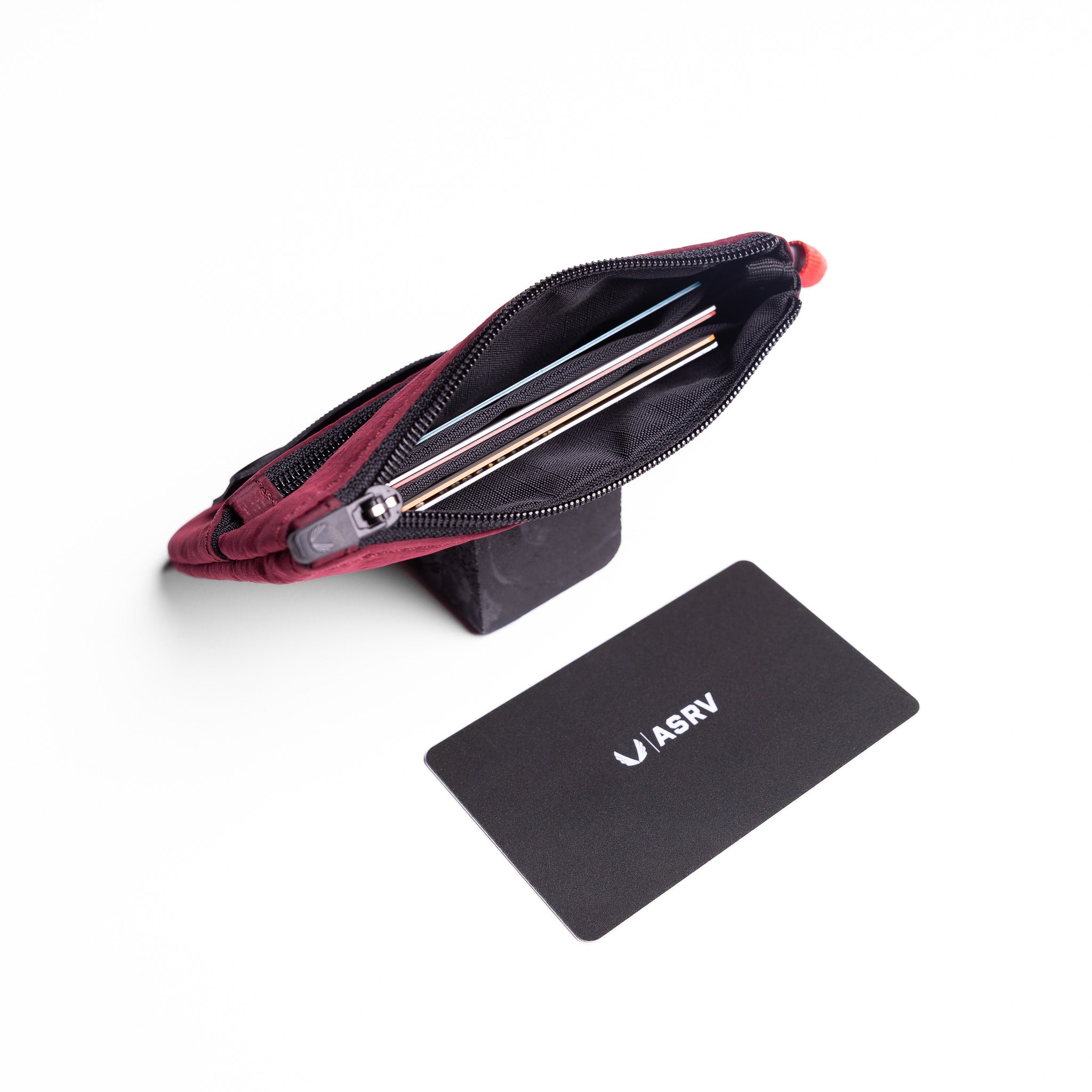 Flatlay 1235 Ripstop Clip Bag in crimson, open view with contents