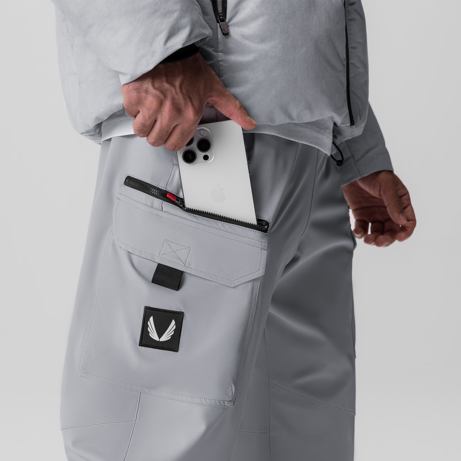 Tetra Weather-Ready City Pant in slate grey, worn by model showing pocket storage detail