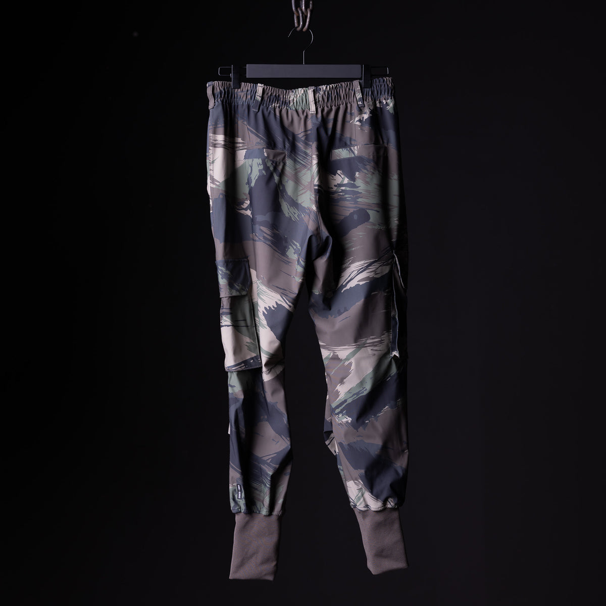 WN'20 Cargo High Rib Jogger in grey camo with elastic cuffs, front view, on hanger
